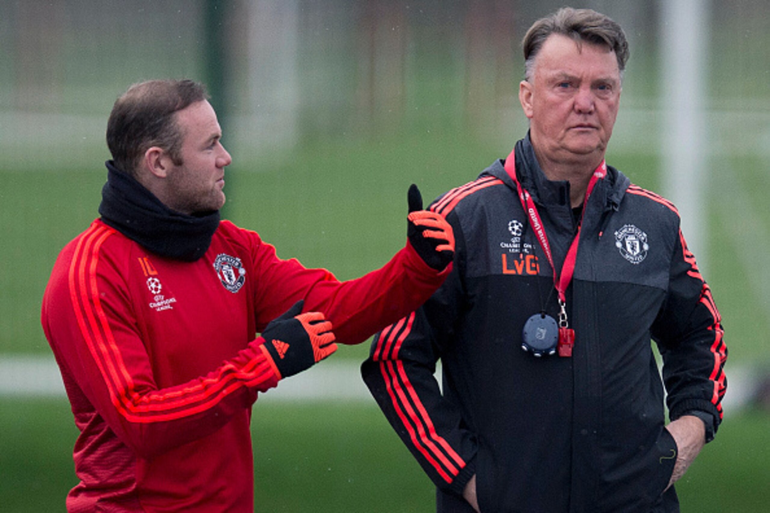 Manchester United's Dutch manager Louis van Gaal (R) talks with Manchester United's English striker Wayne Rooney during a team training session in Manchester, north west England, on November 24, 2015, ahead of their UEFA Champions League Group B football 