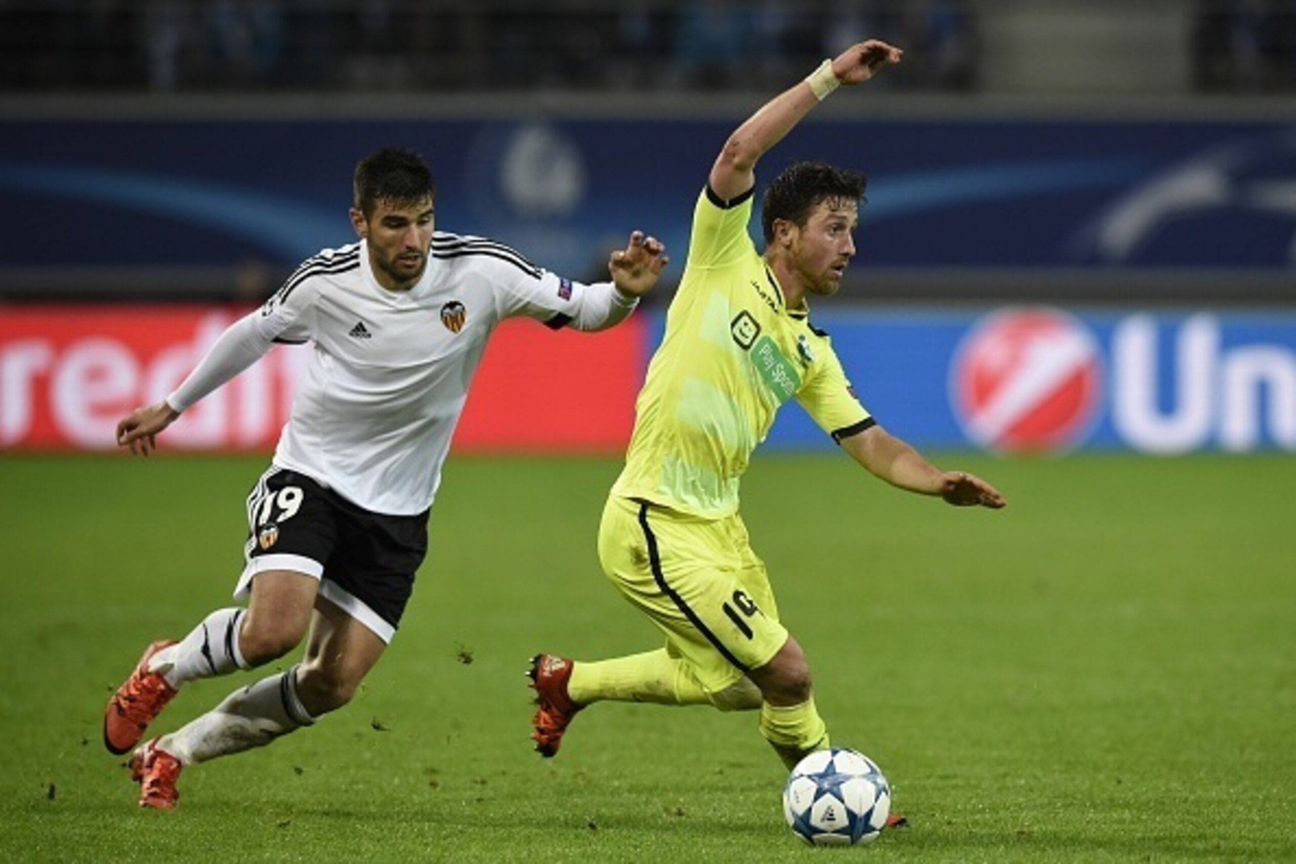 Ghent's Belgian midfielder Brecht Dejaeghere (R) vies with Valencia's Spanish defender Antonio Barragan during the UEFA Champions League Group H second-leg football match between KAA Gent and Valencia CF at the KAA Gent Stadium in Ghent, Belgium on Novemb