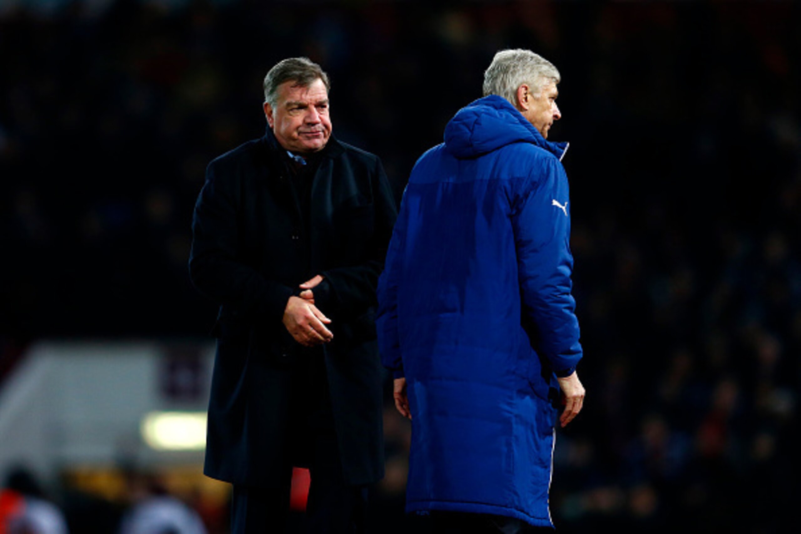 LONDON, ENGLAND - DECEMBER 28:  Arsene Wenger, manager of Arsenal walks past Sam Allardyce the West Ham manager during the Barclays Premier League match between West Ham United and Arsenal at Boleyn Ground on December 28, 2014 in London, England.  (Photo 
