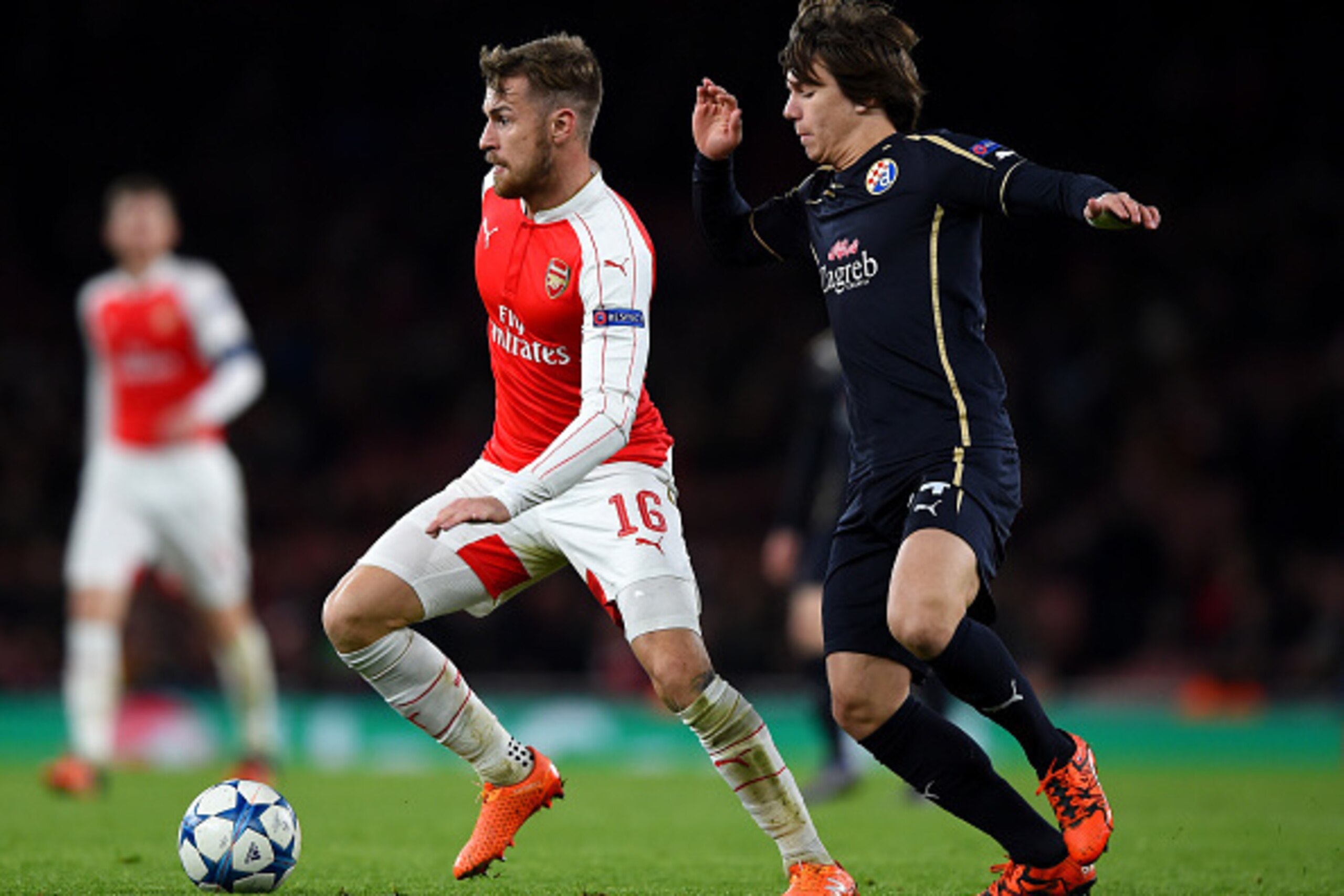 LONDON, ENGLAND - NOVEMBER 24:  Aaron Ramsey of Arsenal holds off Ante Coric of Dinamo Zagreb during the UEFA Champions League match between Arsenal FC and GNK Dinamo Zagreb at Emirates Stadium on November 24, 2015 in London, United Kingdom.  (Photo by Sh