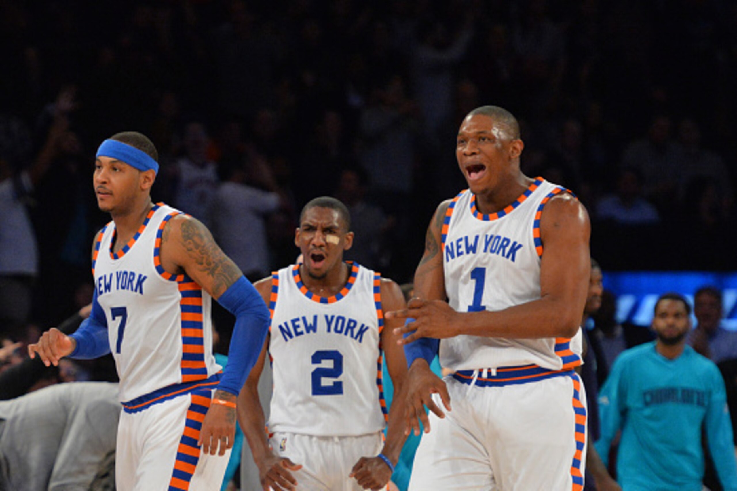 NEW YORK,NY - NOVEMBER 17: Langston Galloway #2 ,Kevin Seraphin #1 and Carmelo Anthony #7 of the New York Knicks beat after a play against the Charlotte Hornets at Madison Square Garden on November 17, 2015 in New York,New York NOTE TO USER: User expressl
