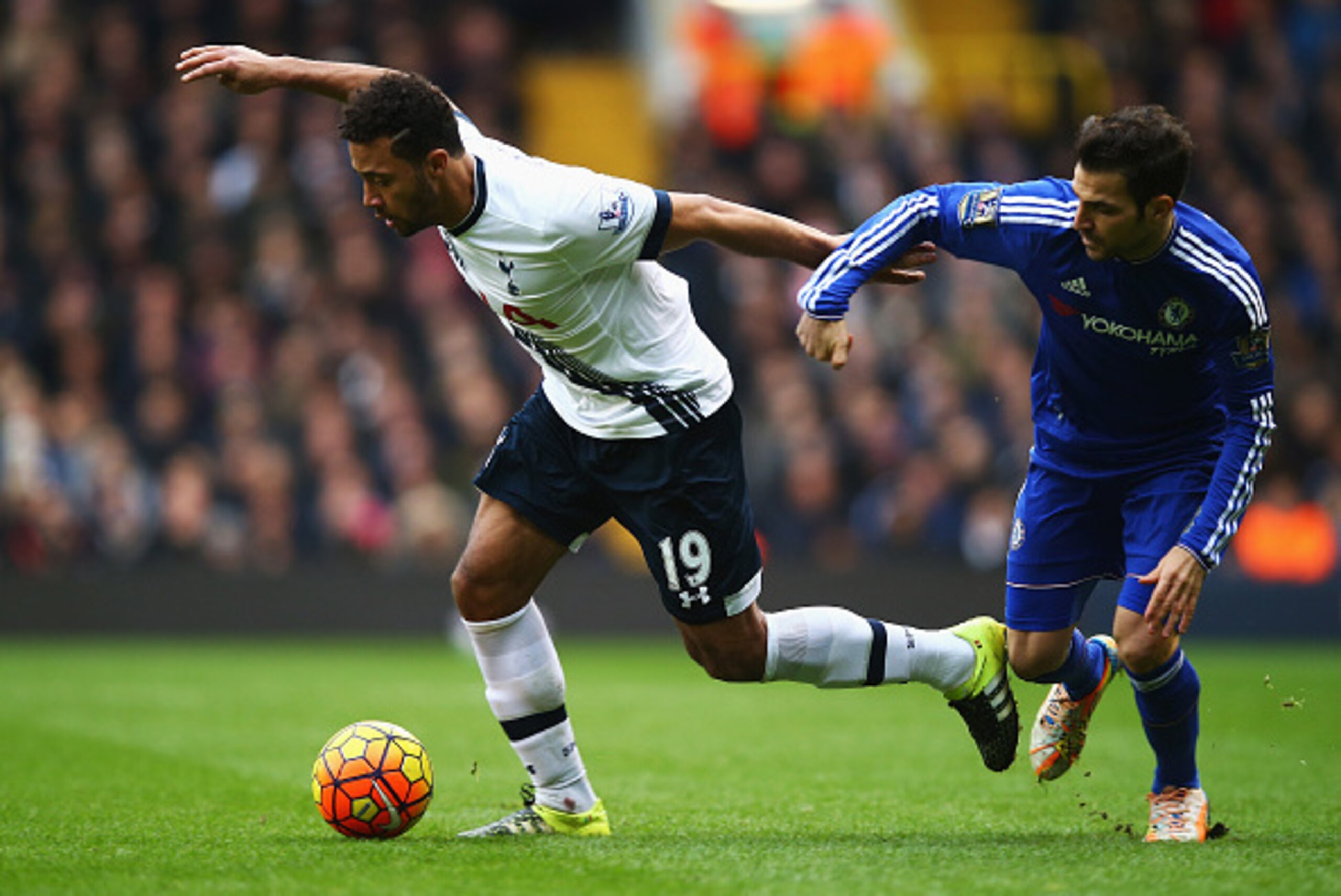 LONDON, ENGLAND - NOVEMBER 29:  Mousa Dembele of Tottenham Hotspur evades Cesc Fabregas of Chelsea during the Barclays Premier League match between Tottenham Hotspur and Chelsea at White Hart Lane on November 29, 2015 in London, England.  (Photo by Clive 