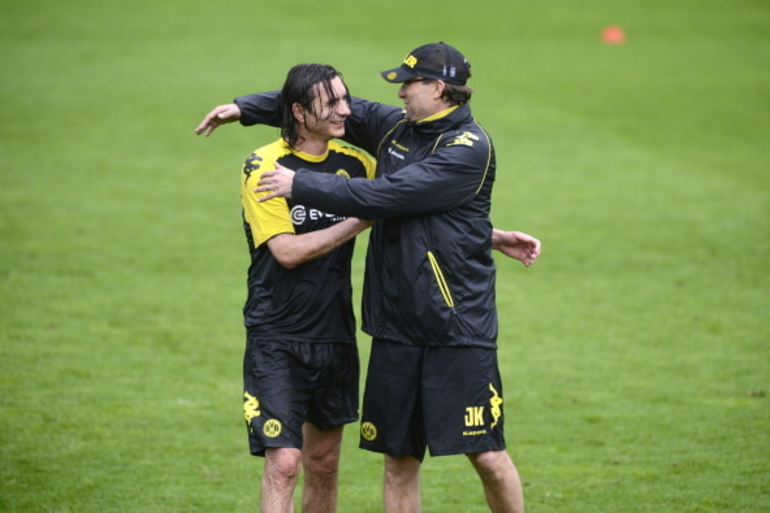 Dortmund's head coach Juergen Klopp (R) shares a joke with Dortmund's US defender Neven Subotic during a training session at the Olympiastadion in Berlin on May 11, 2012 on the eve of the German cup 'DFB Pokal' final game. Dortmund will face Bayern Munich Dortmund's head coach Juergen Klopp (R) shares a joke with Dortmund's US defender Neven Subotic during a training session at the Olympiastadion in Berlin on May 11, 2012 on the eve of the German cup 'DFB Pokal' final game. Dortmund will face Bayern Munich