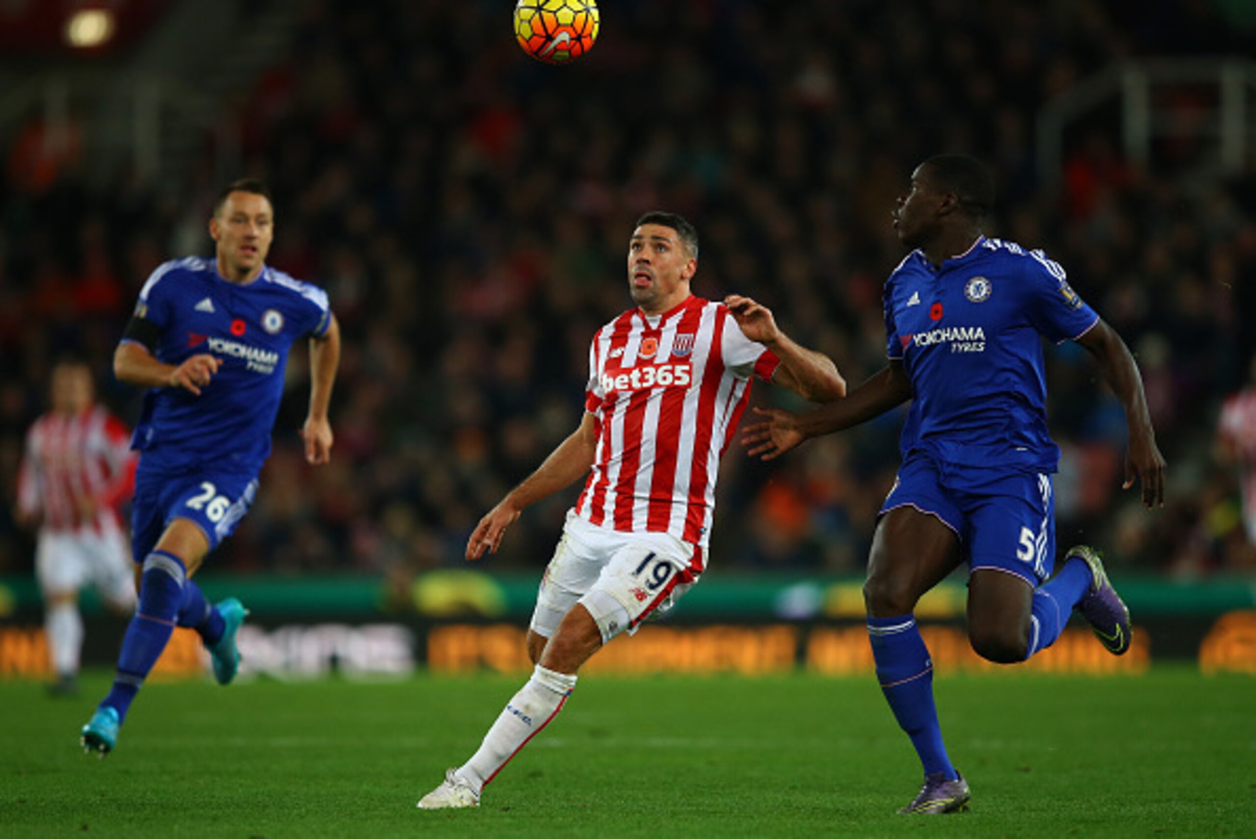 STOKE ON TRENT, ENGLAND - NOVEMBER 07: Jonathan Walters of Stoke City and Kurt Zouma of Chelsea compete for the ball during the Barclays Premier League match between Stoke City and Chelsea at Britannia Stadium on November 7, 2015 in Stoke on Trent, Englan
