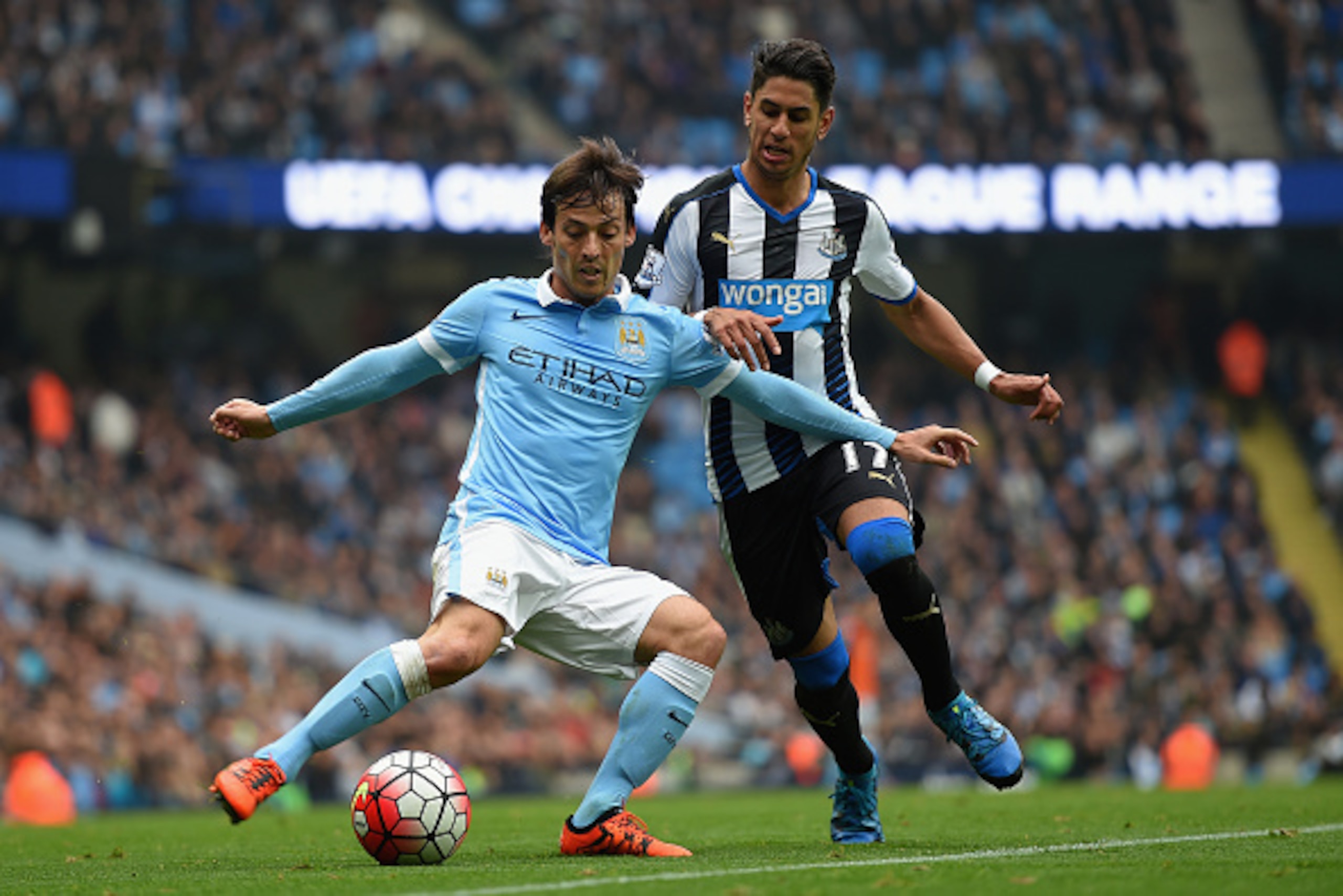 MANCHESTER, ENGLAND - OCTOBER 03: David Silva of Manchester City in action with Ayoze Perez of Newcastle United during the Barclays Premier League match between Manchester City and Newcastle United at Etihad Stadium on October 3, 2015 in Manchester, Unite