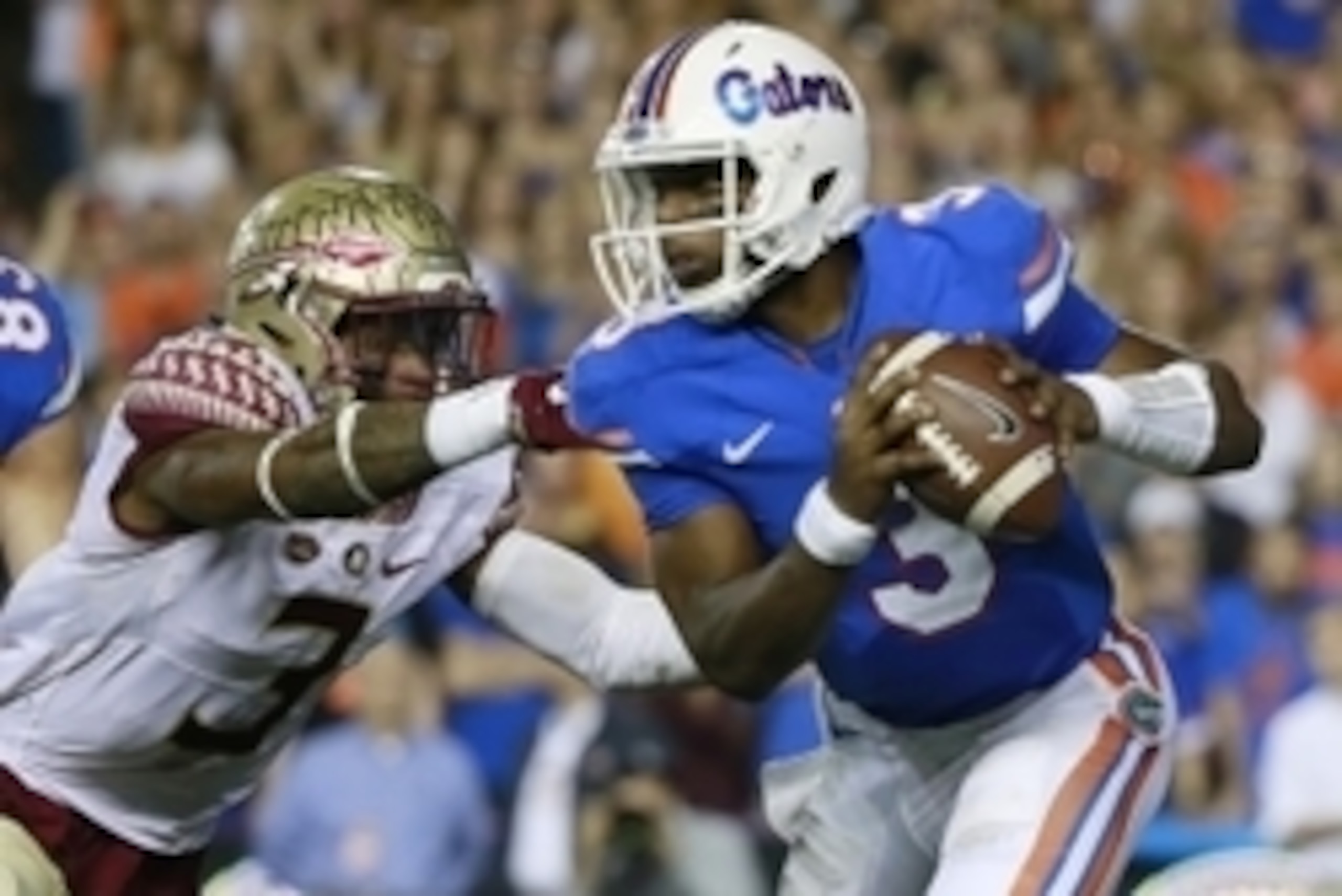 Nov 28, 2015; Gainesville, FL, USA; Florida Gators quarterback Treon Harris (3) runs as Florida State Seminoles defensive back Derwin James (3) pressures  during the second quarter at Ben Hill Griffin Stadium. Mandatory Credit: Kim Klement-USA TODAY Sport