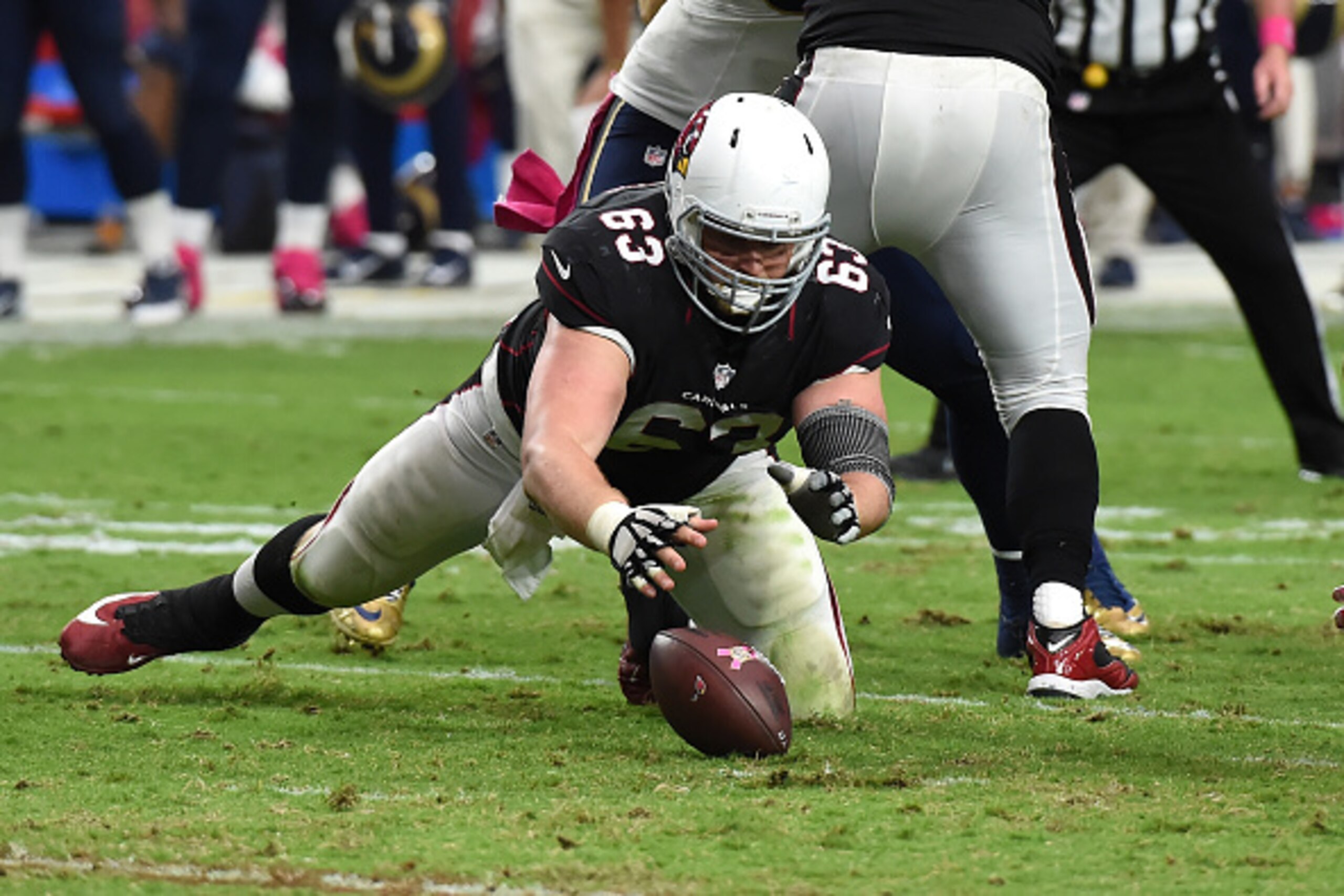 GLENDALE, AZ - OCTOBER 04: Center Lyle Sendlein #63 of the Arizona Cardinals falls on a loose ball during the second half of the NFL game against the St Louis Rams at University of Phoenix Stadium on October 4, 2015 in Glendale, Arizona.  (Photo by Norm H
