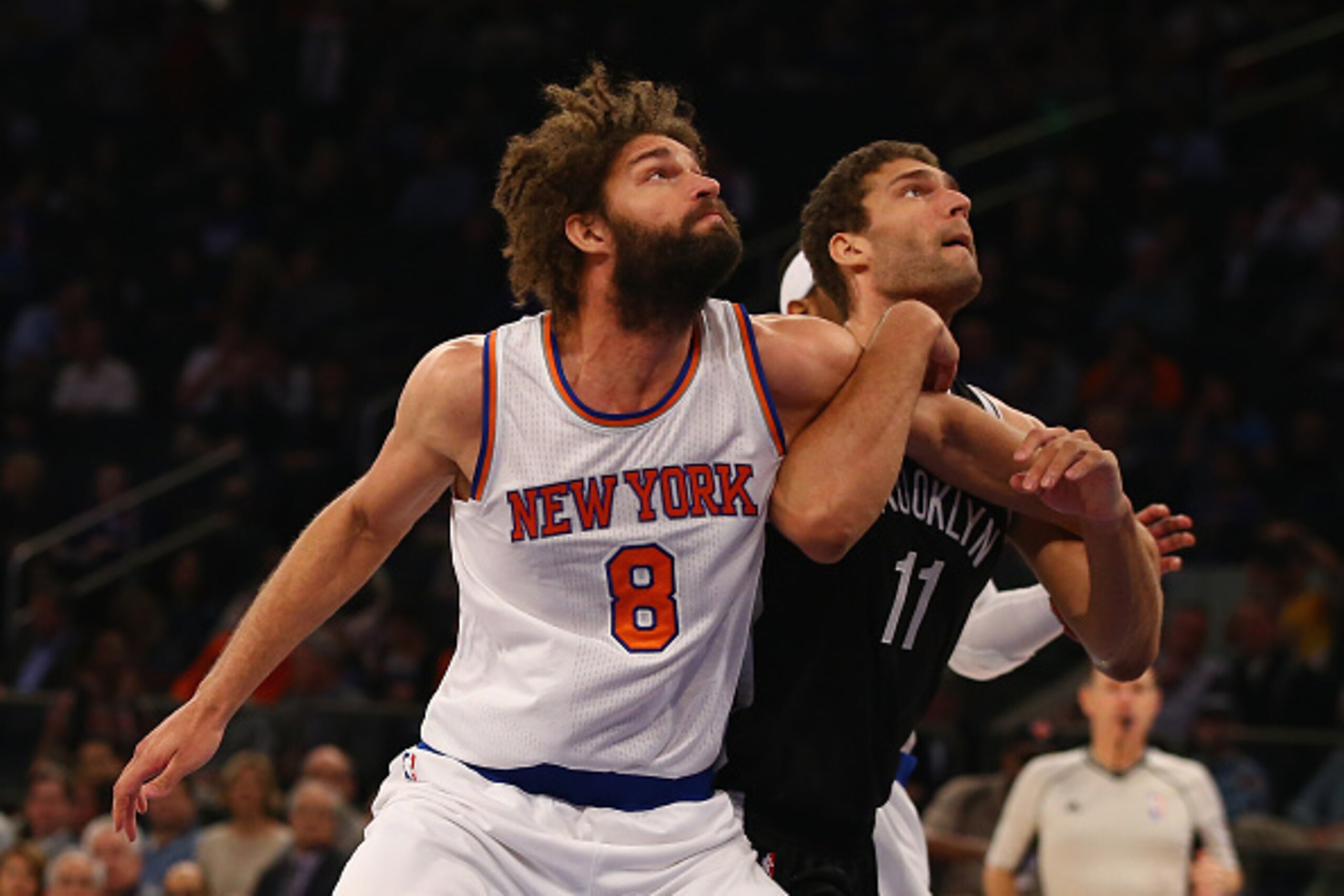 NEW YORK, NY - DECEMBER 04:  Brook Lopez #11 of the Brooklyn Nets and Robin Lopez #8 of the New York Knicks battle under the boards during their game at Madison Square Garden on December 4, 2015 in New York City.  NOTE TO USER: User expressly acknowledges