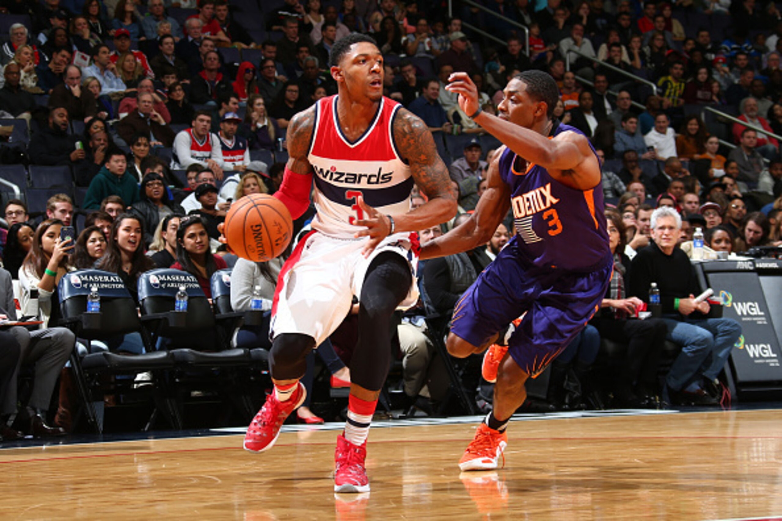 WASHINGTON, DC -  DECEMBER 4:  Bradley Beal #3 of the Washington Wizards drives to the basket against Brandon Knight #3 of the Phoenix Suns on December 4, 2015 at Verizon Center in Washington, DC. NOTE TO USER: User expressly acknowledges and agrees that,