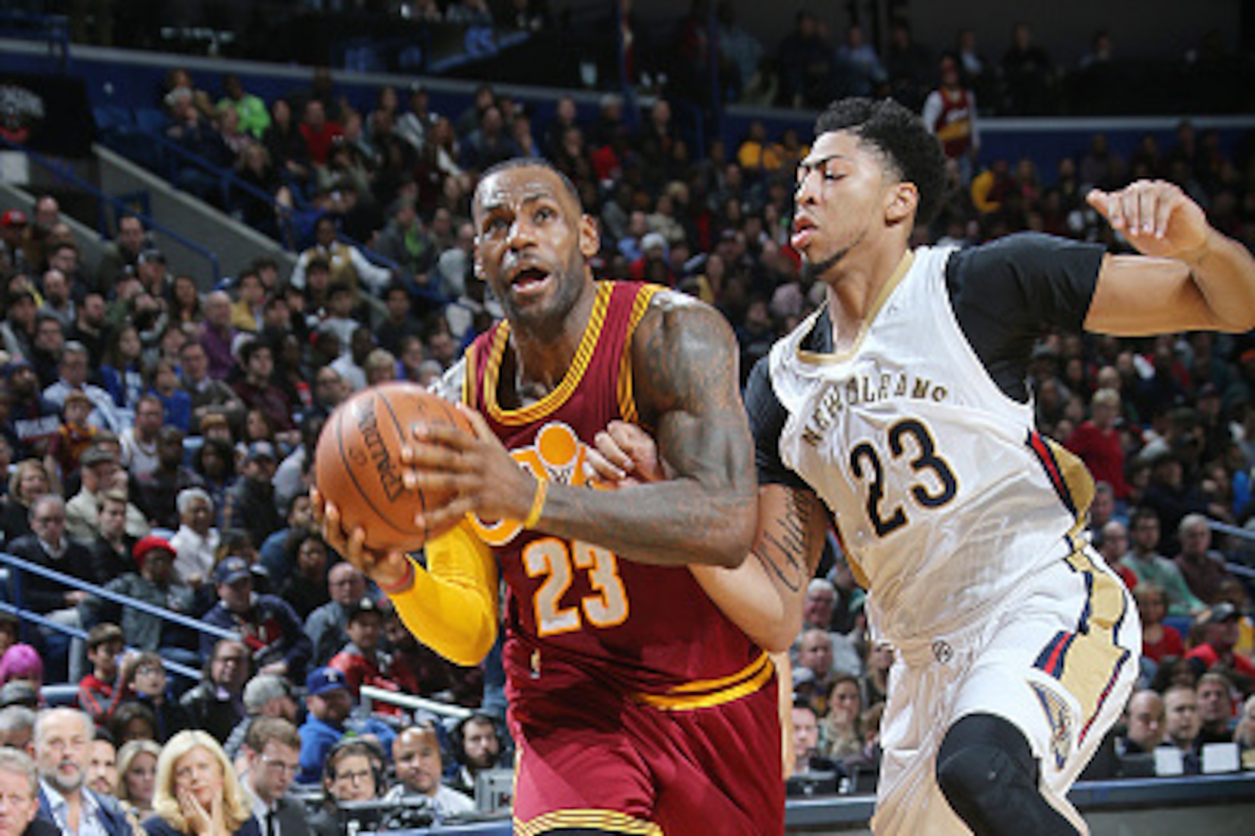 NEW ORLEANS, LA - DECEMBER 4:  LeBron James #23 of the Cleveland Cavaliers drives to the basket against Anthony Davis #23 of the New Orleans Pelicans on December 4, 2015 at Smoothie King Center in New Orleans, Louisiana. NOTE TO USER: User expressly ackno