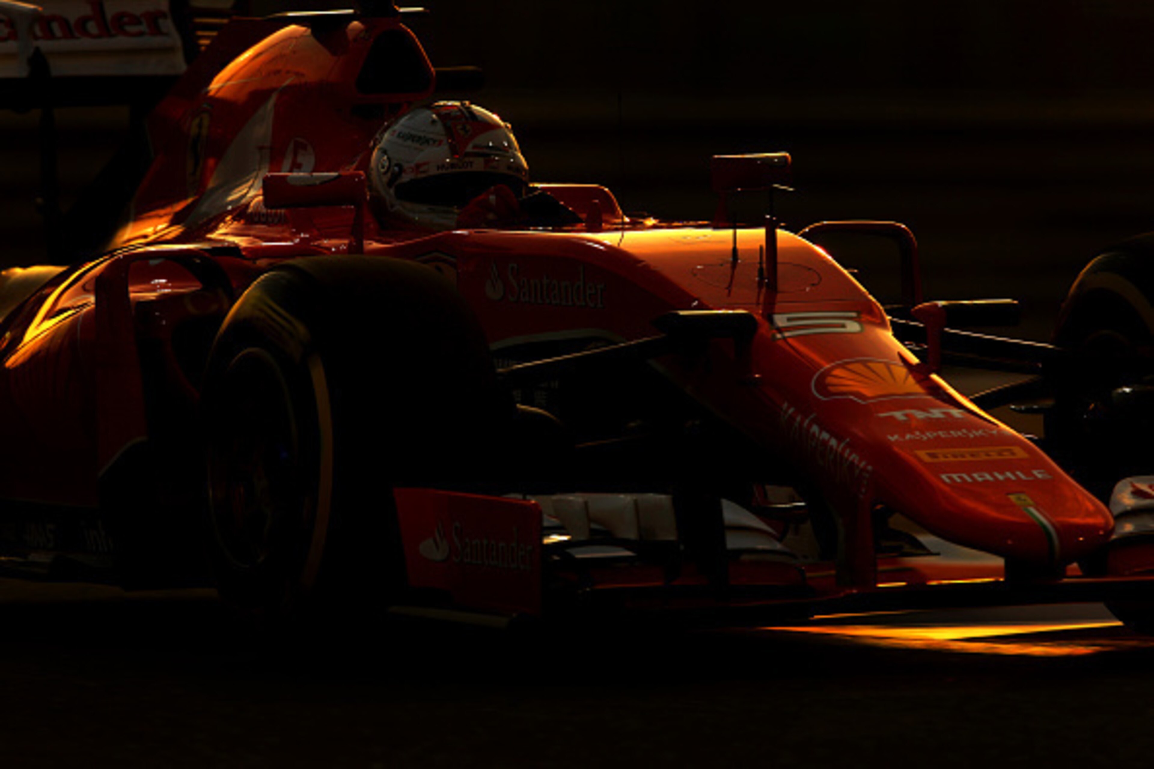 ABU DHABI, UNITED ARAB EMIRATES - NOVEMBER 28:  Sebastian Vettel of Germany and Ferrari drives during qualifying for the Abu Dhabi Formula One Grand Prix at Yas Marina Circuit on November 28, 2015 in Abu Dhabi, United Arab Emirates.  (Photo by Clive Mason