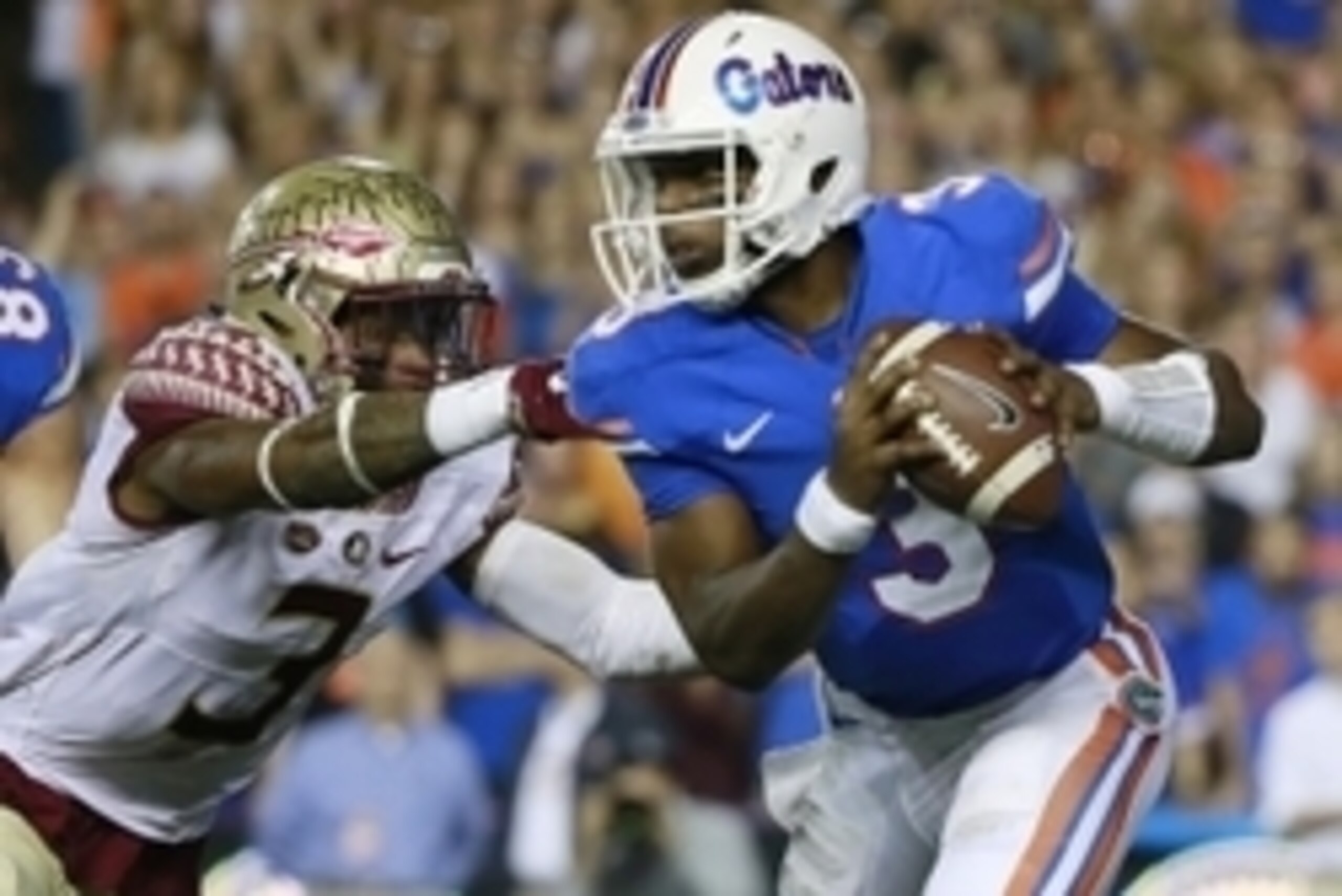 Nov 28, 2015; Gainesville, FL, USA; Florida Gators quarterback Treon Harris (3) runs as Florida State Seminoles defensive back Derwin James (3) pressures  during the second quarter at Ben Hill Griffin Stadium. Mandatory Credit: Kim Klement-USA TODAY Sport