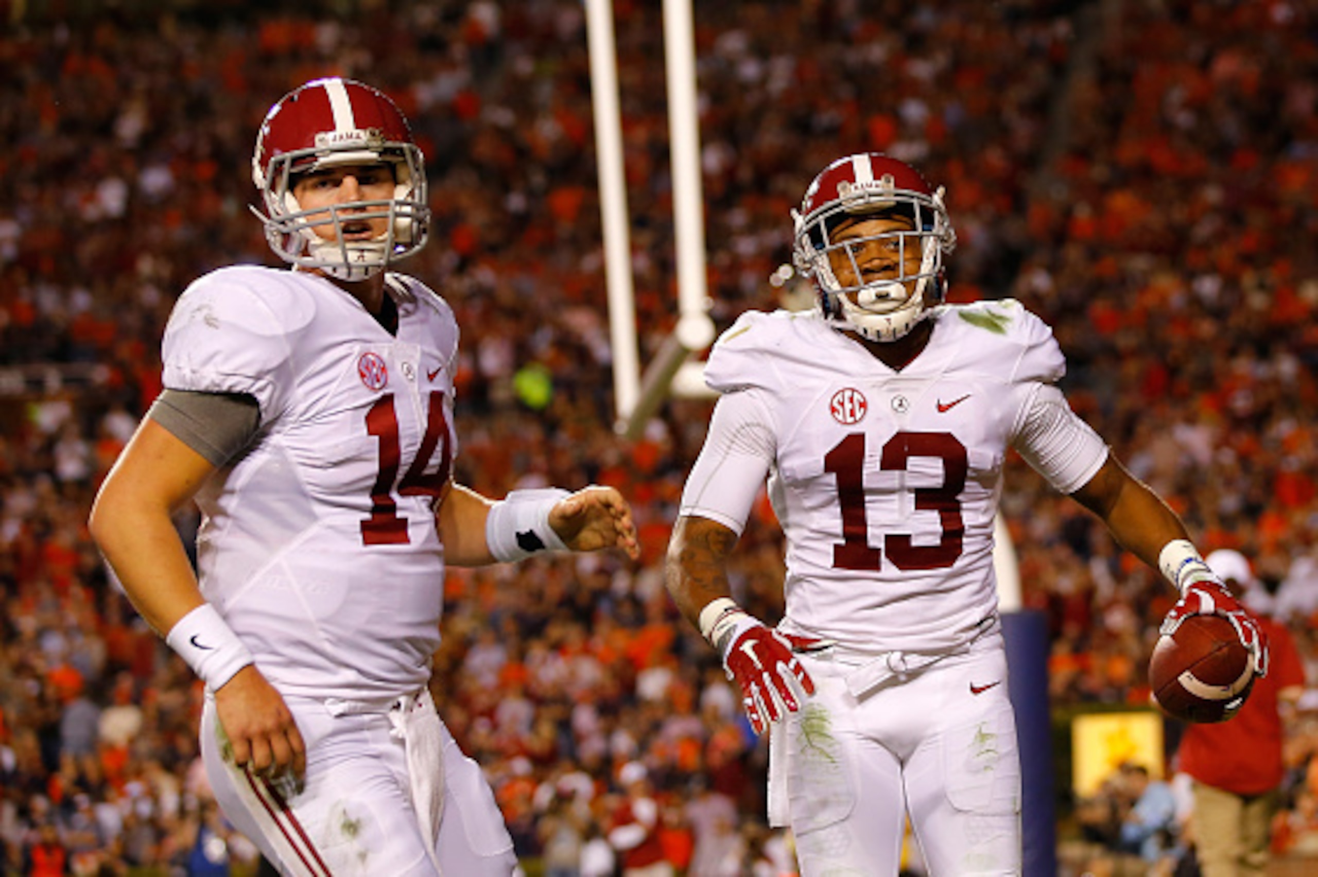 AUBURN, AL - NOVEMBER 28:  ArDarius Stewart #13 of the Alabama Crimson Tide reacts after a touchdown reception from Jake Coker #14 against the Auburn Tigers at Jordan Hare Stadium on November 28, 2015 in Auburn, Alabama.  (Photo by Kevin C. Cox/Getty Imag