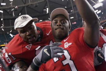 ATLANTA - DECEMBER 3:  Leonard Pope #81 and D.J. Shockley #3 of the Georgia Bulldogs celebrate after their 34-14 win over the Louisiana State University Tigers during the 2005 SEC Football Championship Game on December 3, 2005 at the Georgia Dome in Atlan