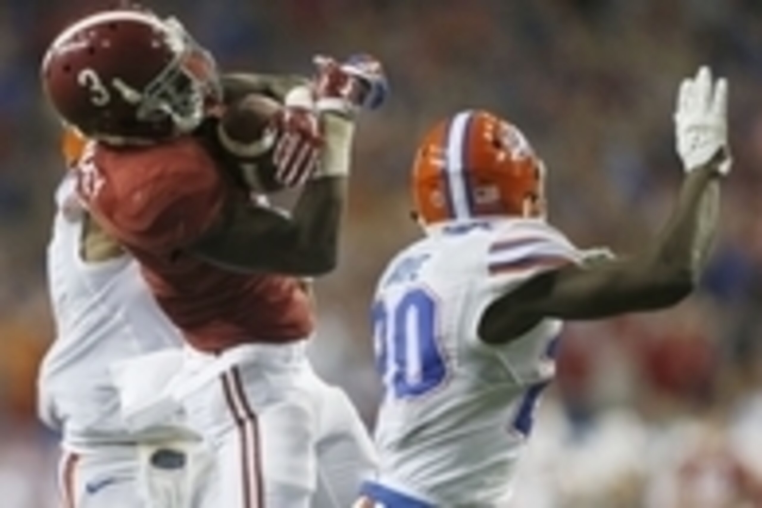 Dec 5, 2015; Atlanta, GA, USA; Alabama Crimson Tide wide receiver Calvin Ridley (3) catches a 55 yard pass between the defense of Florida Gators defensive back Vernon Hargreaves III (1) and Marcus Maye (20) during the second quarter in the 2015 SEC Champi