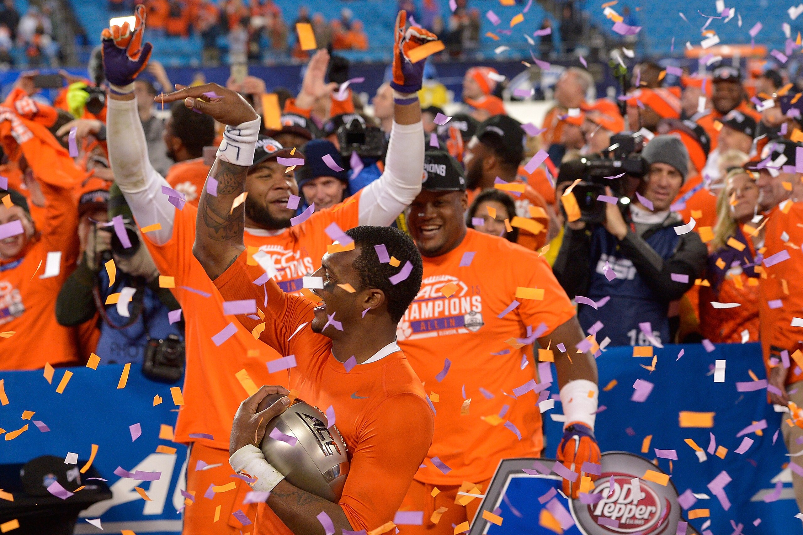 CHARLOTTE, NC - DECEMBER 05:  Deshaun Watson #4 of the Clemson Tigers celebrates with teammates after winning the Atlantic Coast Conference Football Championship against the North Carolina Tar Heels at Bank of America Stadium on December 5, 2015 in Charlo