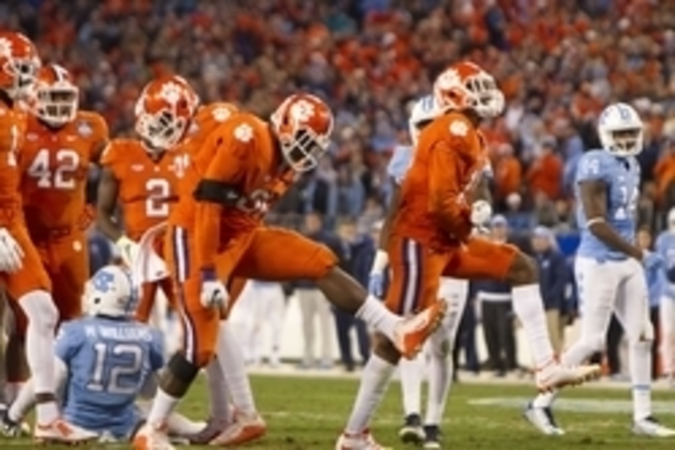 Dec 5, 2015; Charlotte, NC, USA; Clemson Tigers defensive end Shaq Lawson (90) and safety T.J. Green (15) react after the play during the first half in the ACC football championship game against the North Carolina Tar Heels at Bank of America Stadium. Man
