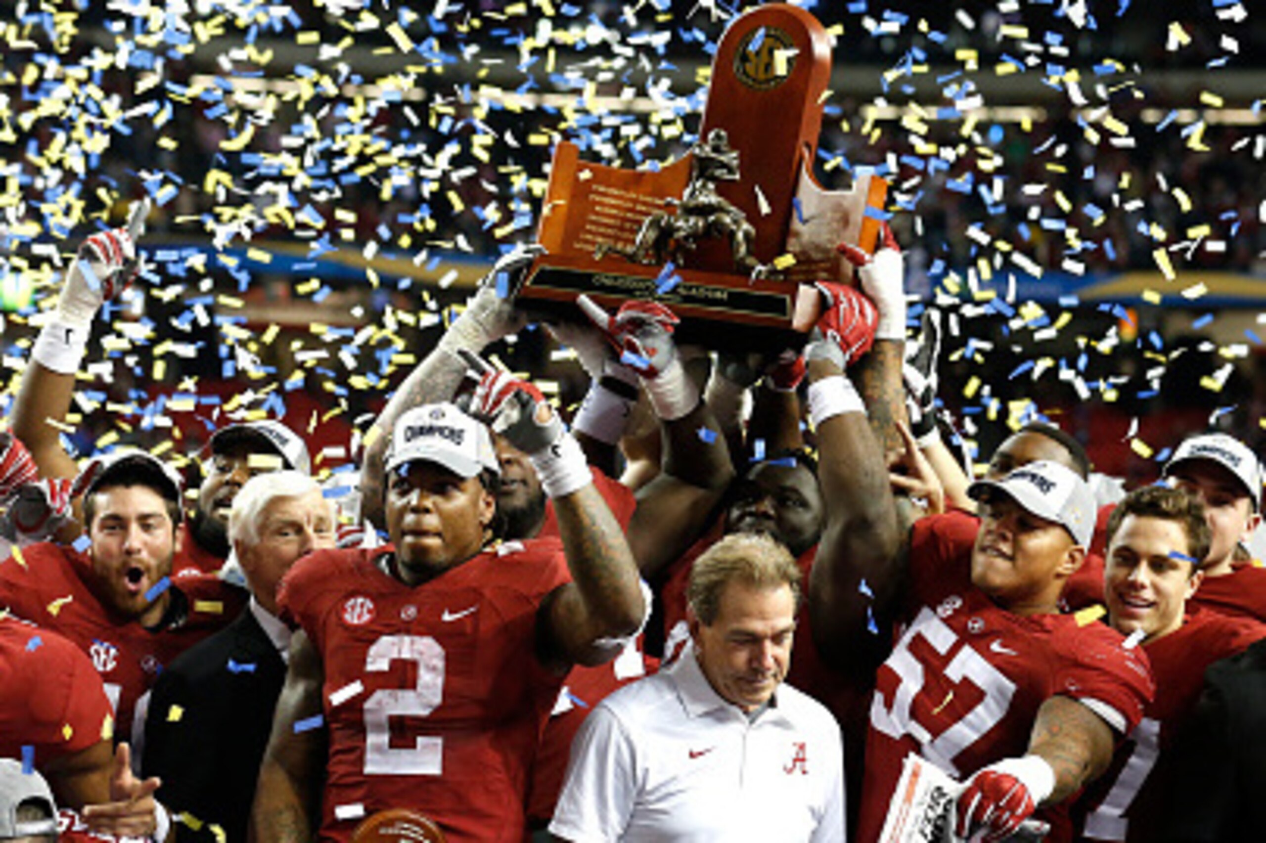 ATLANTA, GA - DECEMBER 5: Running back Derrick Henry #2 of the Alabama Crimson Tide celebrates with head coach Nick Saban of the Alabama Crimson Tide and defensive lineman D.J. Pettway #57 of the Alabama Crimson Tide after defeating the Florida Gators 29-