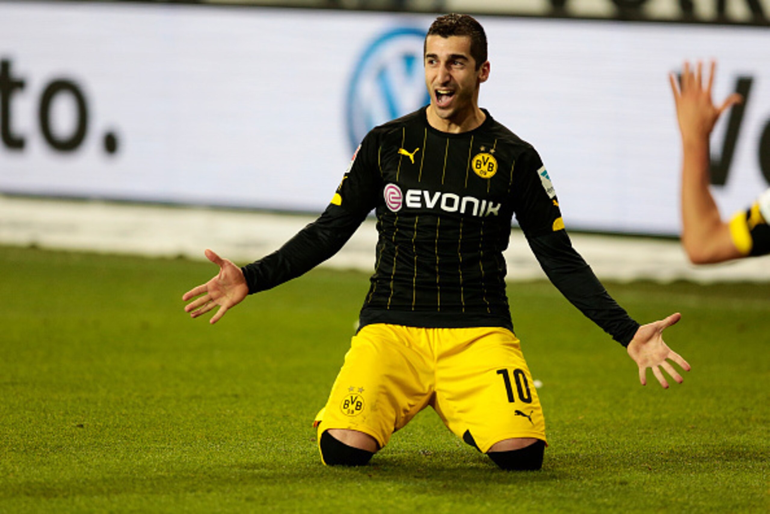 WOLFSBURG, GERMANY - DECEMBER 05:  Henrikh Mkhitaryan of Dortmund celebrate the second goal during the First Bundesliga match at between VfL Wolfsburg and Borussia Dortmund at Volkswagen Arena on December 5, 2015 in Wolfsburg, Germany.  (Photo by Oliver H
