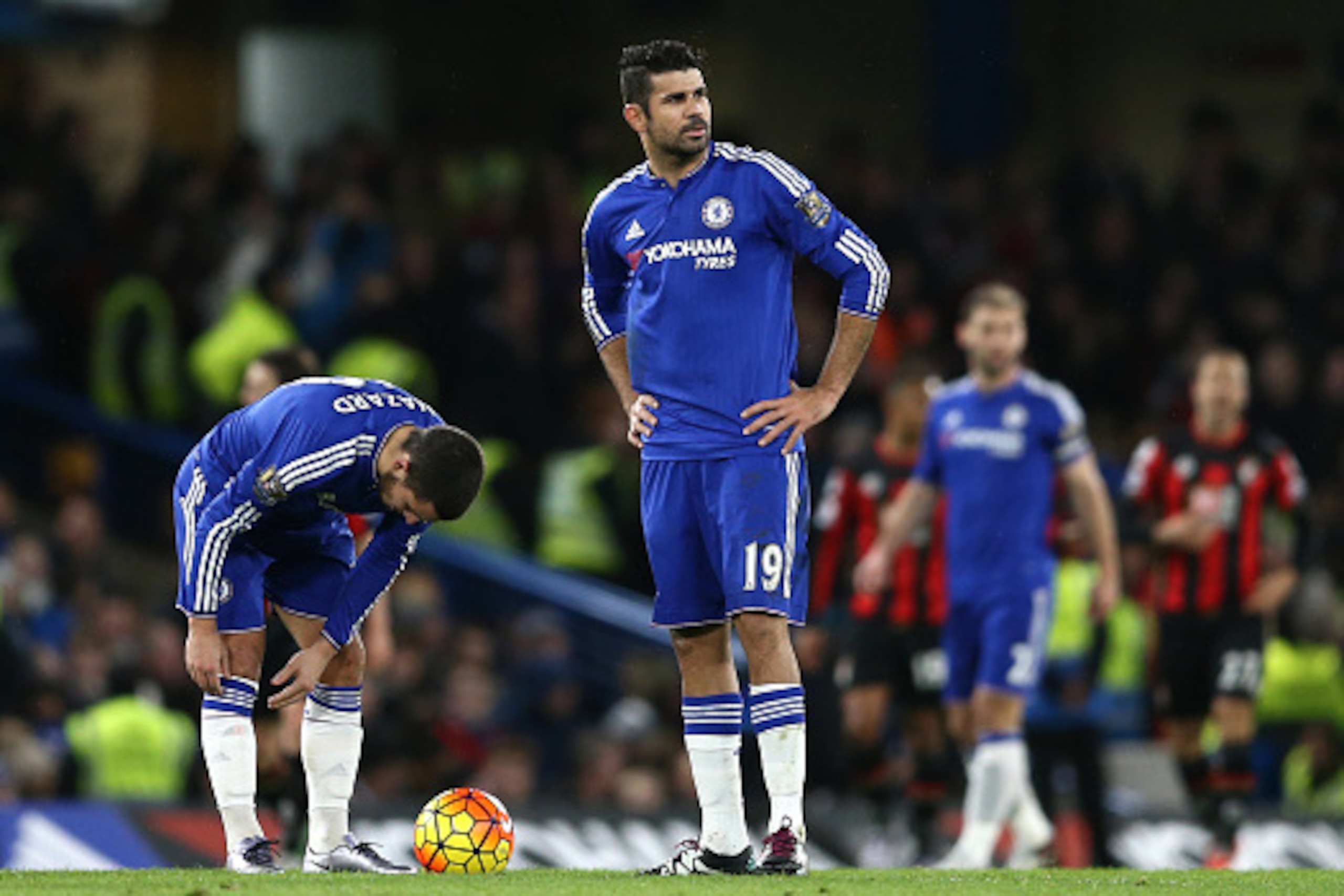 Chelsea's Belgian midfielder Eden Hazard and Chelsea's Brazilian-born Spanish striker Diego Costa (R) wait to restart the game after Bournemouth scored during the English Premier League football match between Chelsea and Bournemouth at Stamford Bridge in 