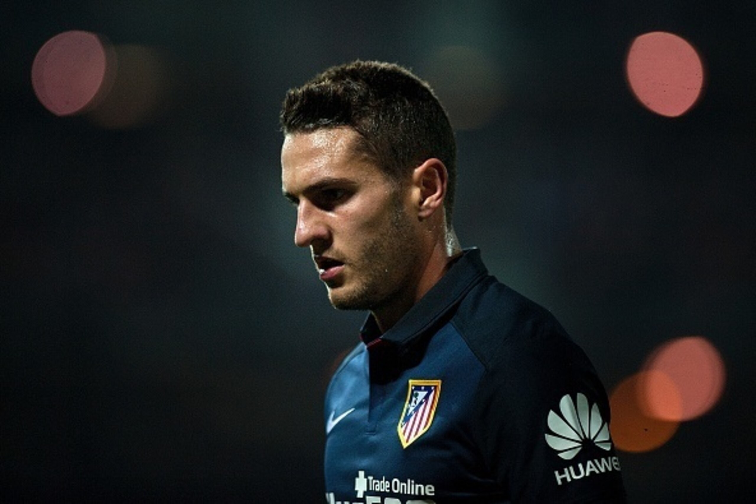 Atletico Madrid's midfielder Koke looks on during the Spanish league football match Granada FC VS Club Atletico de Madrid at Nuevo Los Carmenes stadium in Granada on December 5, 2015.   AFP PHOTO / JORGE GUERRERO / AFP / Jorge Guerrero        (Photo credi