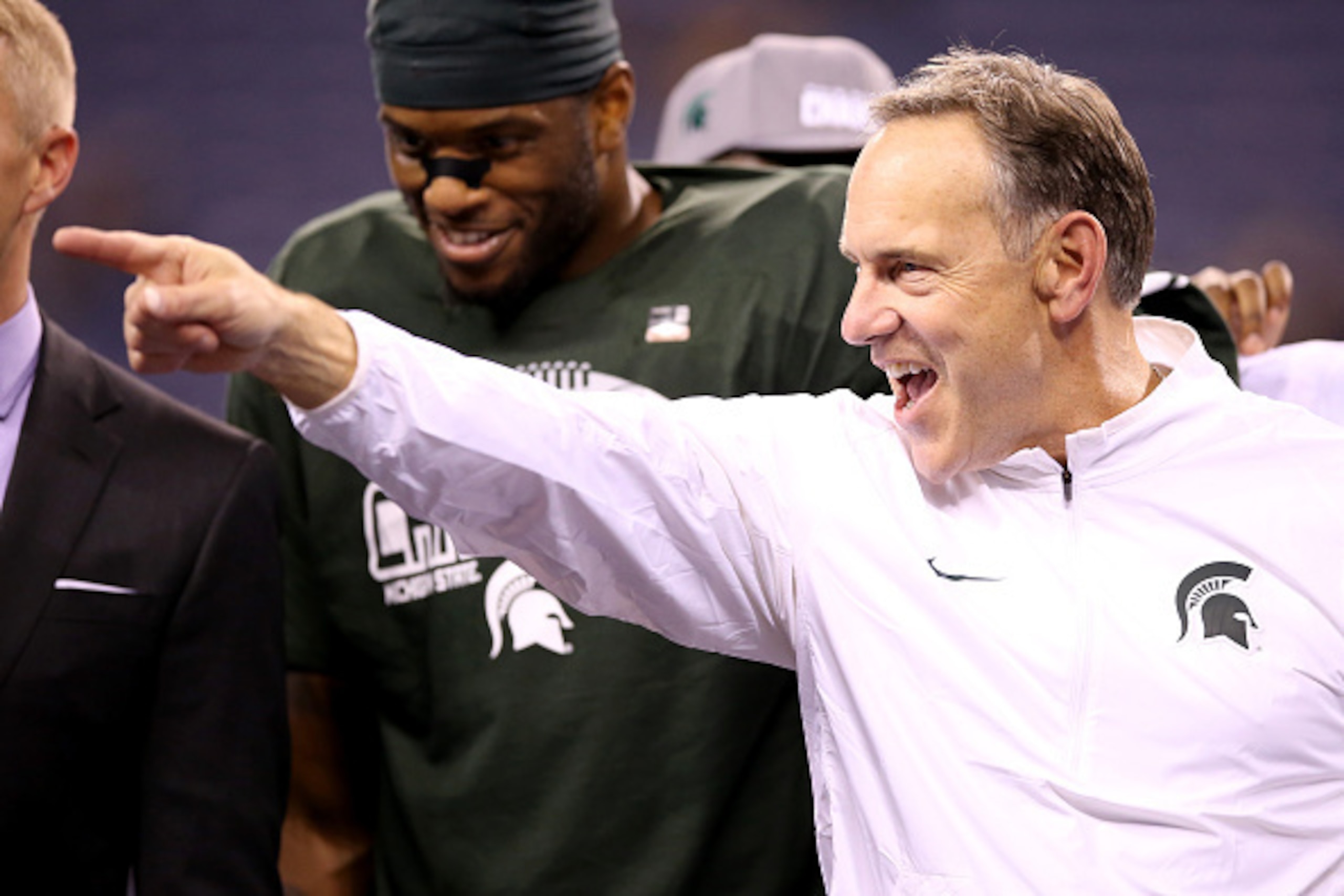 INDIANAPOLIS, IN - DECEMBER 05:  Head coach Mark Dantonio of the Michigan State Spartans celebrates after beating the Iowa Hawkeyes in the Big Ten Championship at Lucas Oil Stadium on December 5, 2015 in Indianapolis, Indiana.  (Photo by Andy Lyons/Getty 