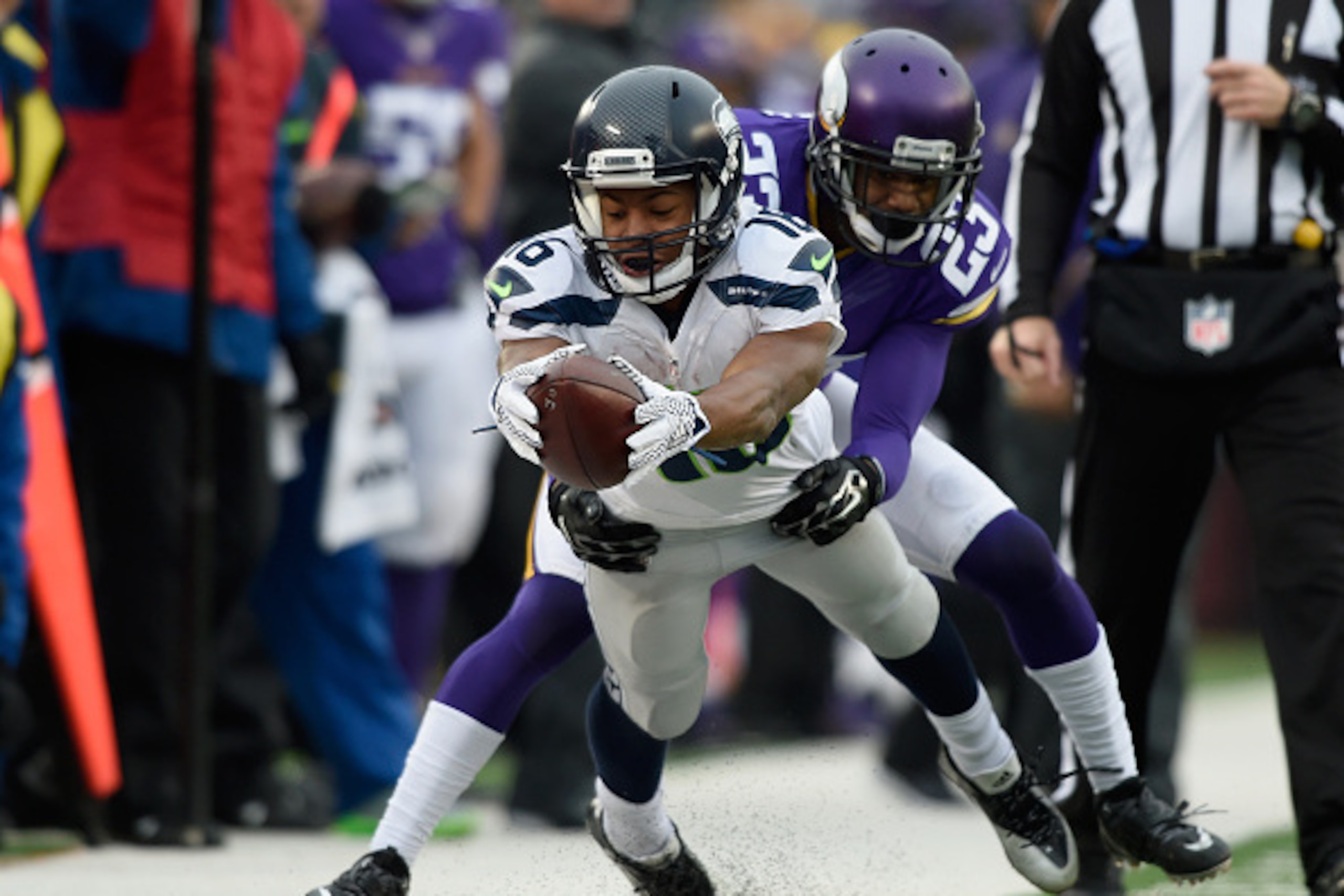 MINNEAPOLIS, MN - DECEMBER 6: Tyler Lockett #16 of the Seattle Seahawks reaches for a first down as Terence Newman #23 of the Minnesota Vikings forces him out of bounds during the fourth quarter of the game on December 6, 2015 at TCF Bank Stadium in Minne