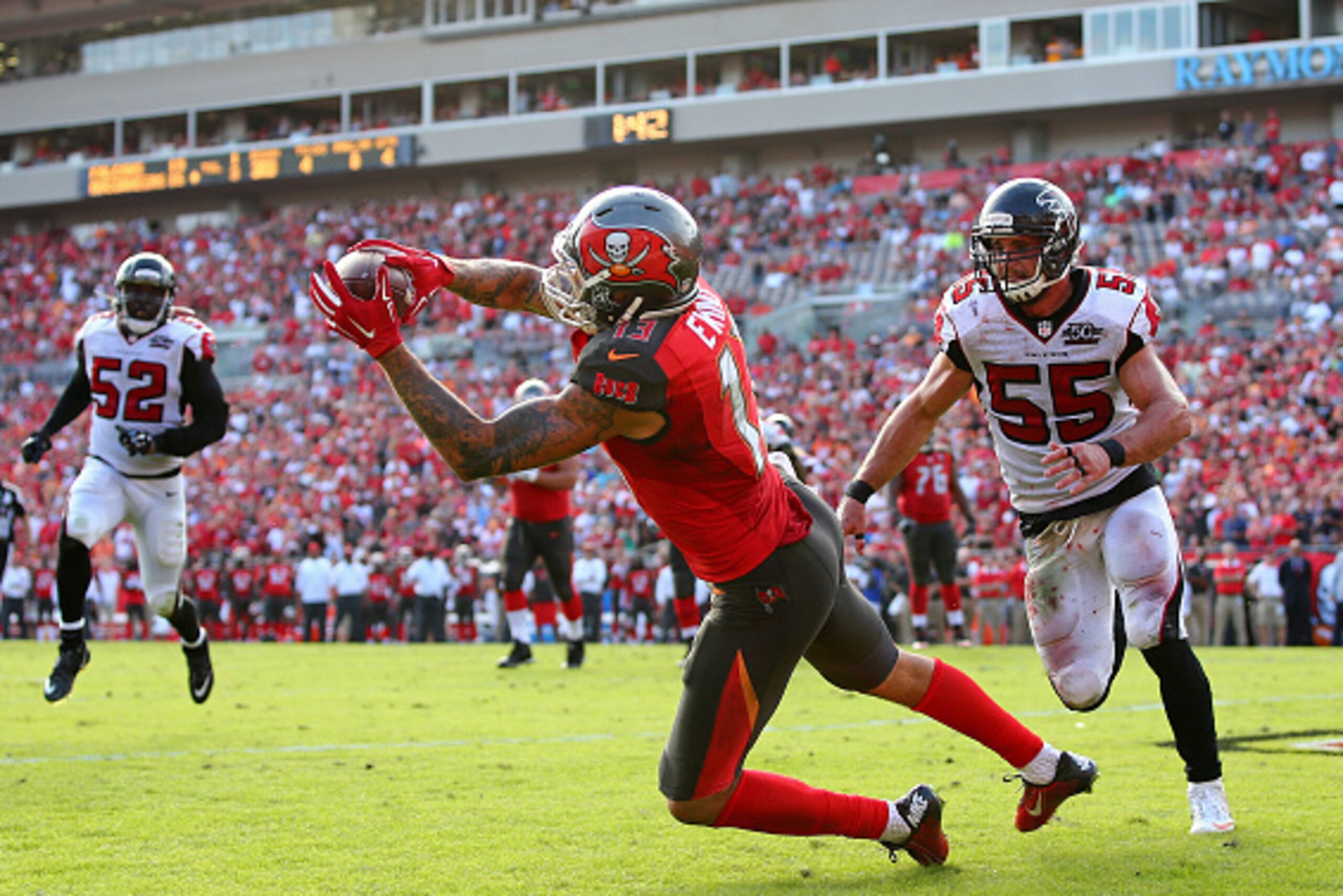 TAMPA, FL - DECEMBER 06:  Mike Evans #13 of the Tampa Bay Buccaneers catches the game-winning touchdown during the fourth quarter of the game against the Atlanta Falcons at Raymond James Stadium on December 6, 2015 in Tampa, Florida.  (Photo by Rob Foldy/