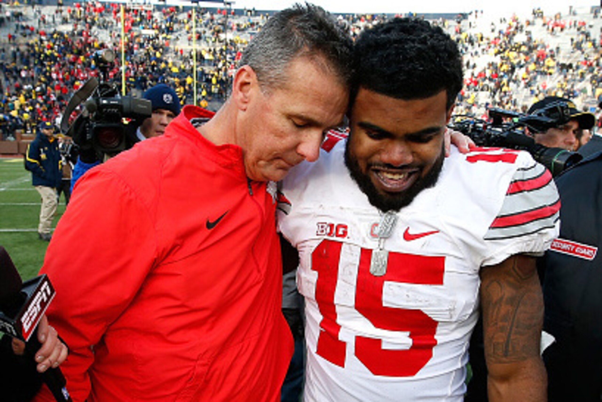 ANN ARBOR, MI - NOVEMBER 28:  Head coach Urban Meyer of the Ohio State Buckeyes celebrates with Ezekiel Elliott #15 after a 42-13 Ohio State win over the Michigan Wolverines at Michigan Stadium on November 28, 2015 in Ann Arbor, Michigan.  (Photo by Grego