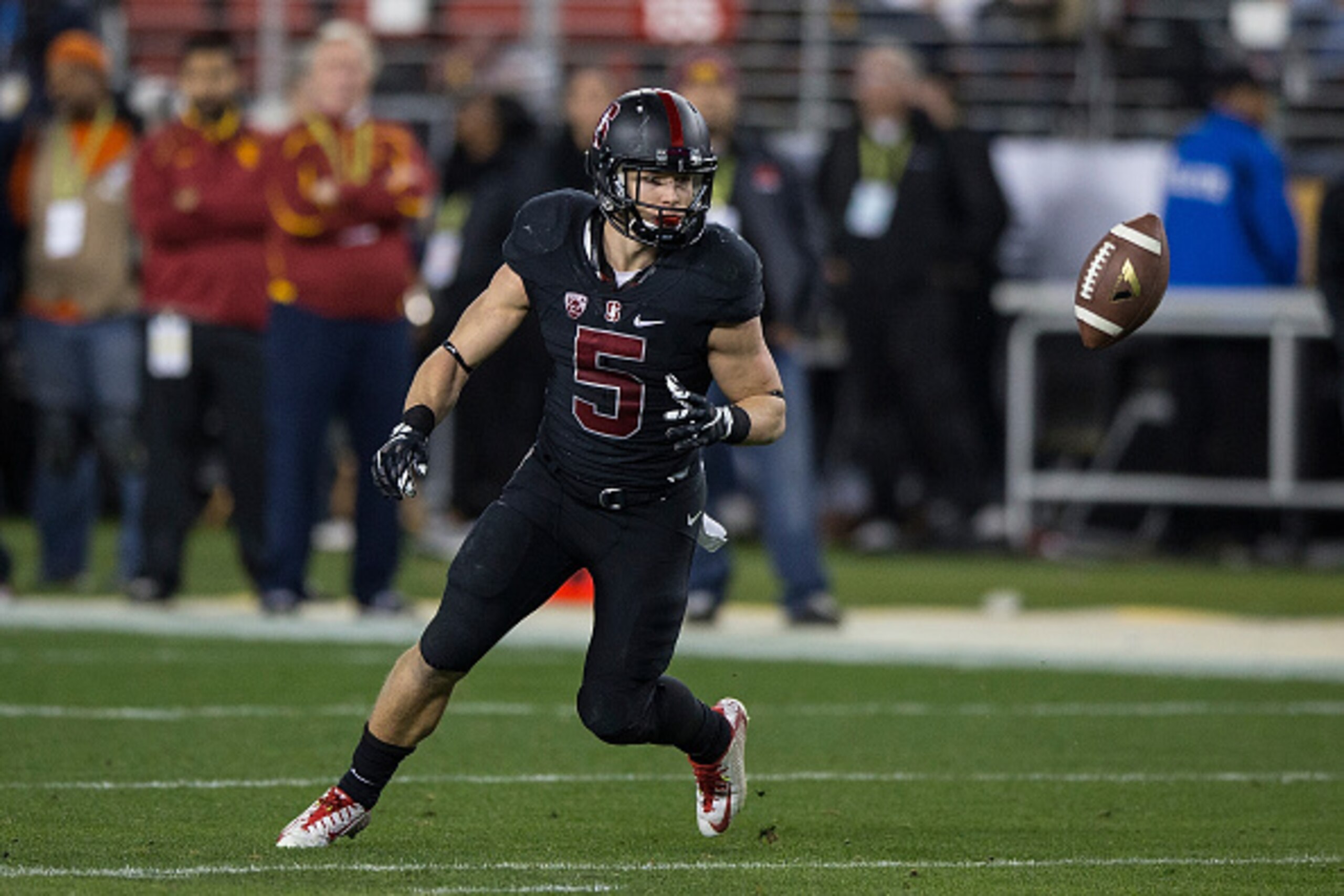 SANTA CLARA, CA - DECEMBER 05:  Running back Christian McCaffrey #5 of the Stanford Cardinal fields a punt against the USC Trojans during the second quarter of the Pac-12 Championship game at Levi's Stadium on December 5, 2015 in Santa Clara, California. 