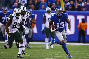EAST RUTHERFORD, NJ - DECEMBER 06:  Odell Beckham #13 of the New York Giants scores a touchdown in the second quarter against the New York Jets during their game at MetLife Stadium on December 6, 2015 in East Rutherford, New Jersey.  (Photo by Al Bello/Ge
