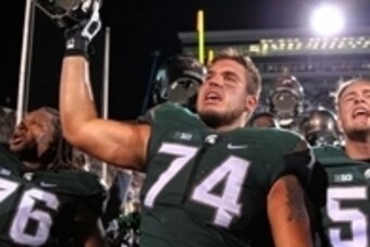 Sep 12, 2015; East Lansing, MI, USA; Michigan State Spartans offensive tackle Jack Conklin (74) celebrates the win over the Oregon Ducks after a game at Spartan Stadium. MSU won 31-28. Mandatory Credit: Mike Carter-USA TODAY Sports