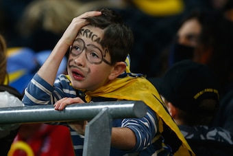 WELLINGTON, NEW ZEALAND - JULY 04:  A Hurricanes fan in despair during the Super Rugby Final match between the Hurricanes and the Highlanders at Westpac Stadium on July 4, 2015 in Wellington, New Zealand.  (Photo by Phil Walter/Getty Images)