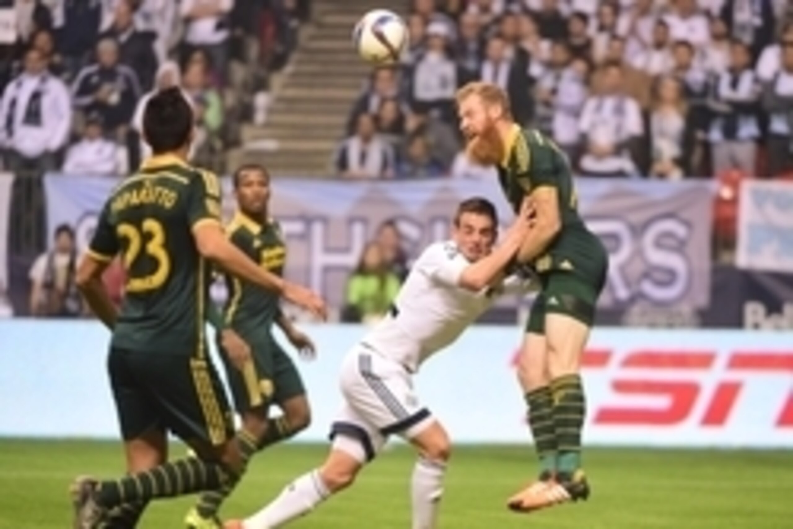 Nov 8, 2015; Vancouver, British Columbia, CAN; Portland Timbers defender Nat Borchers (7) heads the ball against Vancouver Whitecaps forward Octavio Rivero (29) during the second half during the MLS Playoffs at BCPlace. The Portland Timbers won 2-0. Manda