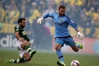 Dec 6, 2015; Columbus, OH, USA; Columbus Crew goalkeeper Steve Clark (1) is unable to clear the ball allowing Portland Timbers midfielder Diego Valeri (8) to score a goal during the first half in the 2015 MLS Cup championship game at MAPFRE Stadium. Manda