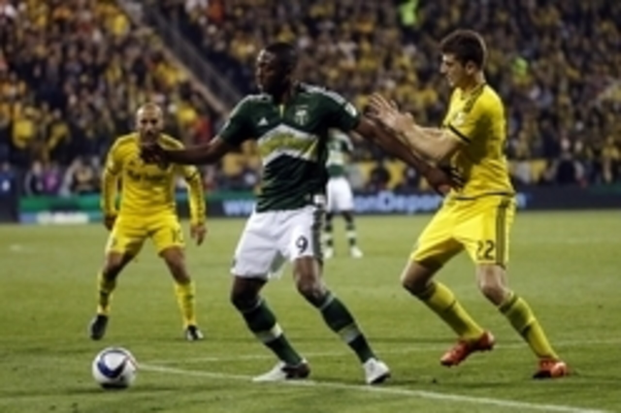 Dec 6, 2015; Columbus, OH, USA; Portland Timbers forward Fanendo Adi (9) battles for the ball with Columbus Crew defender Gaston Sauro (22) during the second half in the 2015 MLS Cup championship game at MAPFRE Stadium. Mandatory Credit: Geoff Burke-USA T