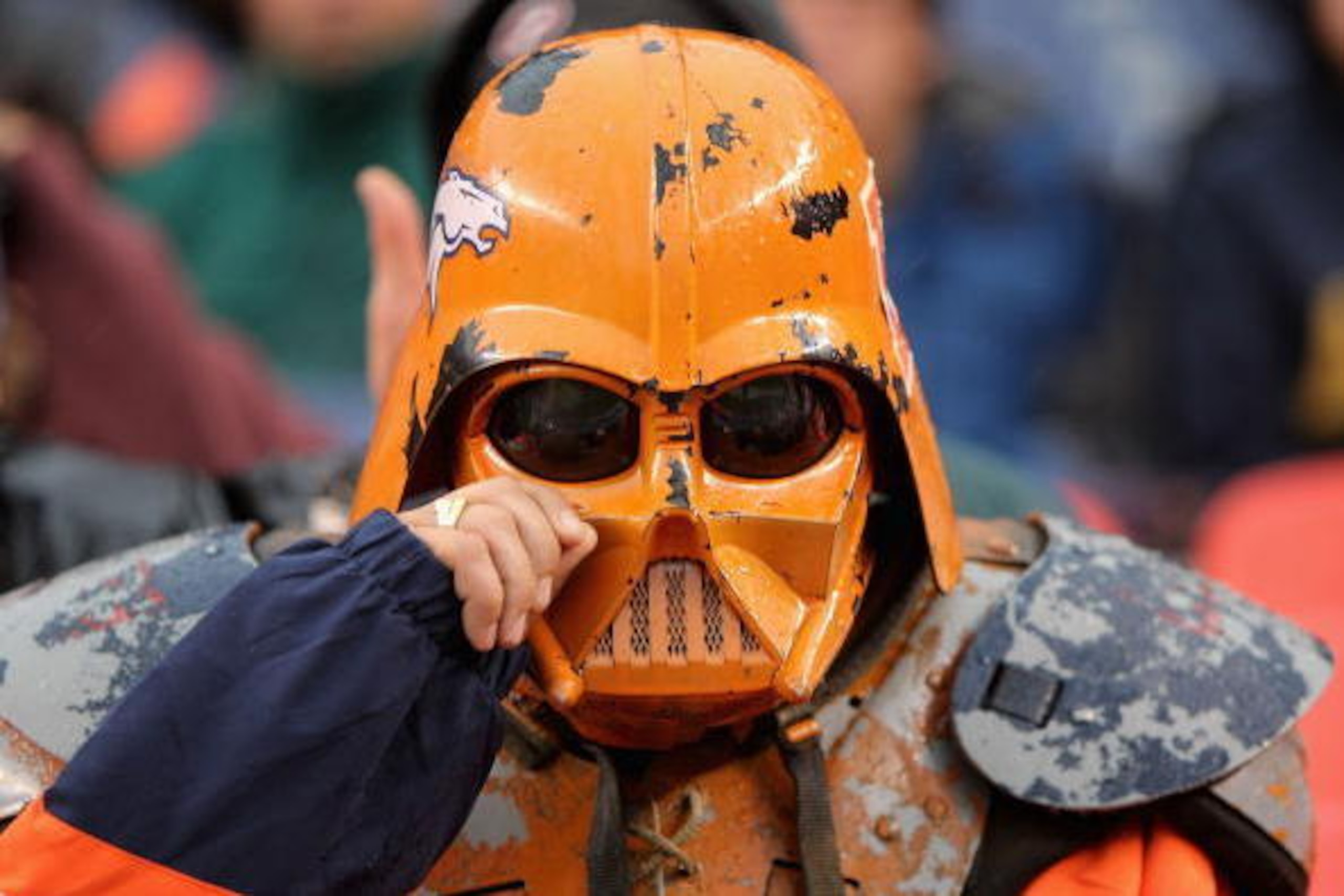 DENVER - OCTOBER 7:  A fan of the Denver Broncos wipes tears from his darth vader helmet during the game against the San Diego Chargers at Invesco Field at Mile High October 7, 2007 in Denver, Colorado. The Chargers defeated the Broncos 41-3.  (Photo by D