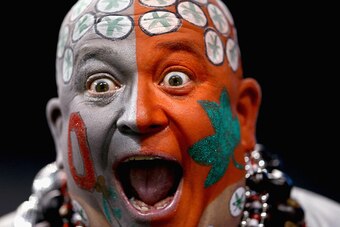 INDIANAPOLIS, IN - DECEMBER 06:  An Ohio State Buckeyes fan cheers before the start of the Big Ten Championship against the Wisconsin Badgers at Lucas Oil Stadium on December 6, 2014 in Indianapolis, Indiana.  (Photo by Andy Lyons/Getty Images)