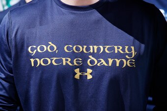 SOUTH BEND, IN - DECEMBER 13: Detail view of Under Armour Notre Dame Fighting Irish shirt worn by a fan during the men's basketball game against the Florida State Seminoles at Purcell Pavilion on December 13, 2014 in South Bend, Indiana. Notre Dame defeat