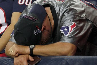 HOUSTON, TX- OCTOBER 09: A Houston Texans fan bends over dejected after the Indianapolis Colts defeated the Houston Texans in a NFL game on October 9, 2014 at NRG Stadium in Houston, Texas. Colts won 33 to 28. (Photo by Bob Levey/Getty Images)