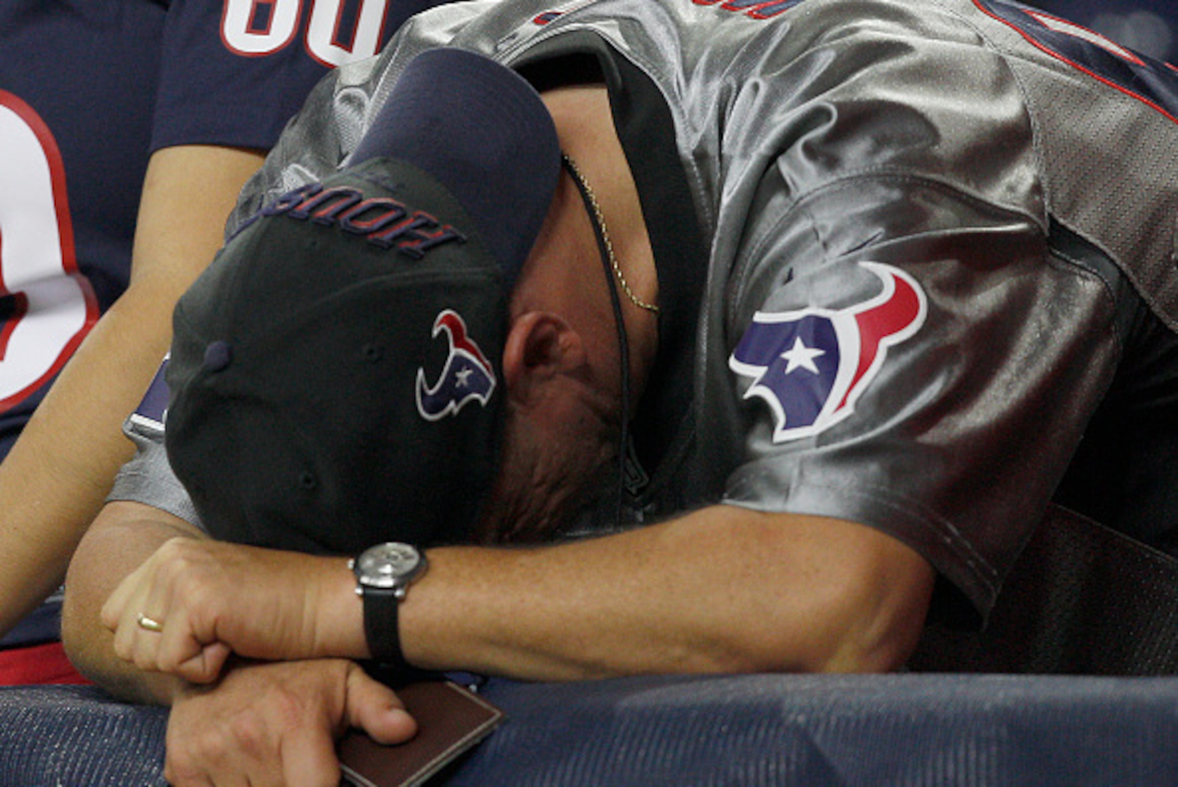 HOUSTON, TX- OCTOBER 09: A Houston Texans fan bends over dejected after the Indianapolis Colts defeated the Houston Texans in a NFL game on October 9, 2014 at NRG Stadium in Houston, Texas. Colts won 33 to 28. (Photo by Bob Levey/Getty Images)