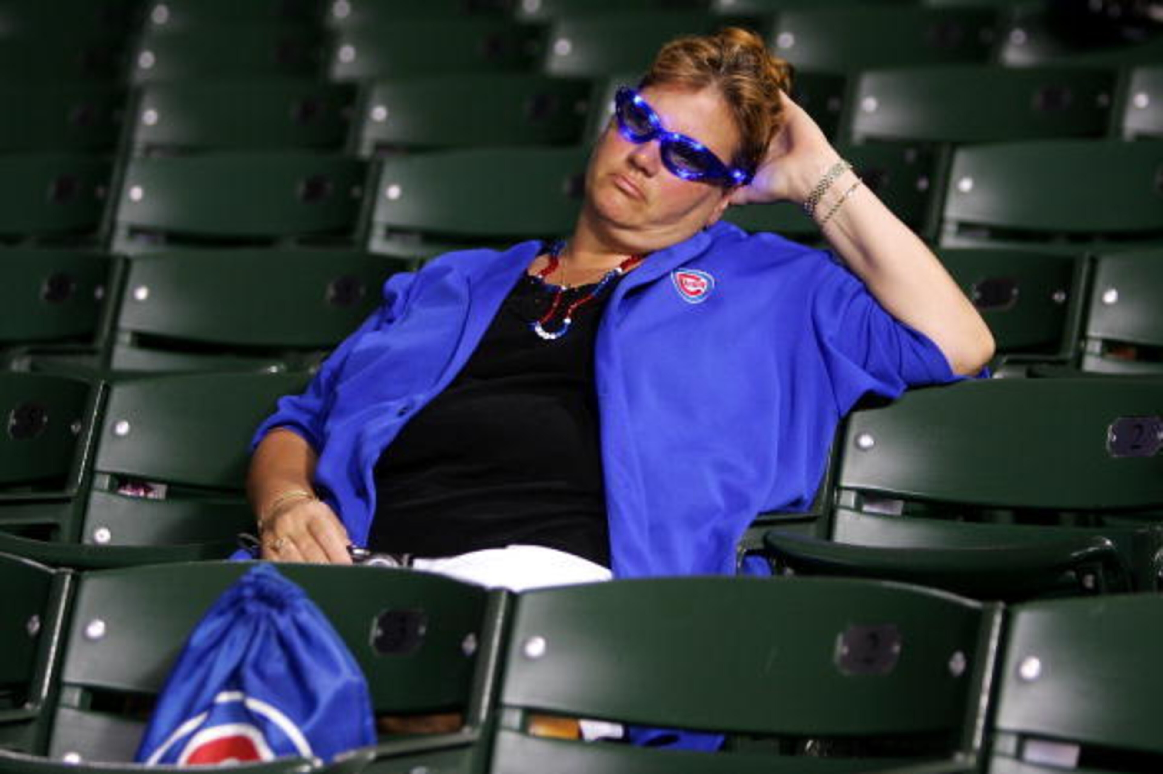 CHICAGO - OCTOBER 06:  A fan of the Chicago Cubs sits in the stands dejected after the Cubs lost 5-1 against the Arizona Diamondbacks during Game Three of the National League Divisional Series at Wrigley Field on October 6, 2007 in Chicago, Illinois. With