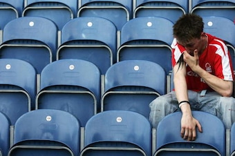 LONDON - APRIL 30:  A Nottingham Forest fan looks dejected after his side lose during the Coca-Cola Championship match between Queens Park Rangers and Nottingham Forest at Loftus Road Stadium on April 30, 2005 in London, England. (Photo by Christopher Lee