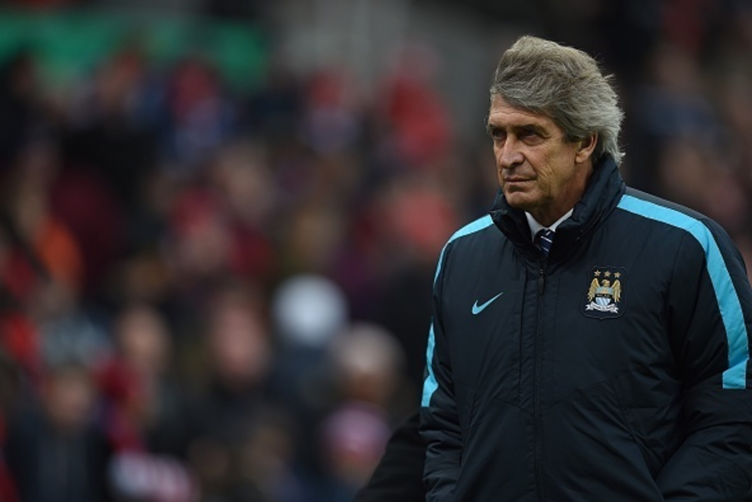 Manchester City's Chilean manager Manuel Pellegrini walks off the pitch at half time during the English Premier League football match between Stoke City and Manchester City at the Britannia Stadium in Stoke-on-Trent, central England on December 5, 2015. Manchester City's Chilean manager Manuel Pellegrini walks off the pitch at half time during the English Premier League football match between Stoke City and Manchester City at the Britannia Stadium in Stoke-on-Trent, central England on December 5, 2015.