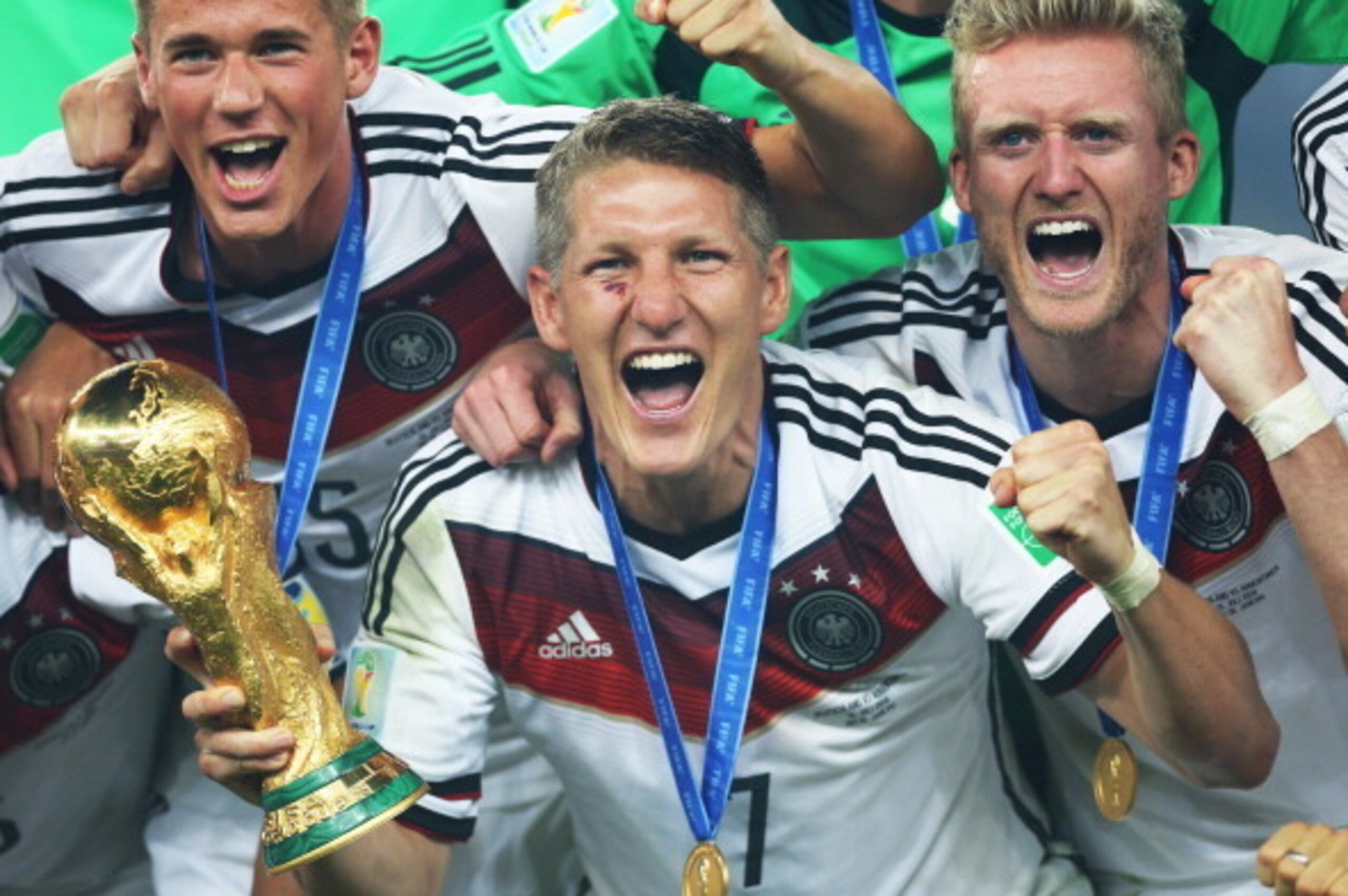 RIO DE JANEIRO, BRAZIL - JULY 13:  Bastian Schweinsteiger of Germany holds the trophy a loft during the 2014 World Cup final match between Germany and Argentina at The Maracana Stadium on July 13, 2014 in Rio de Janeiro, Brazil. (Photo by Ian MacNicol/Get