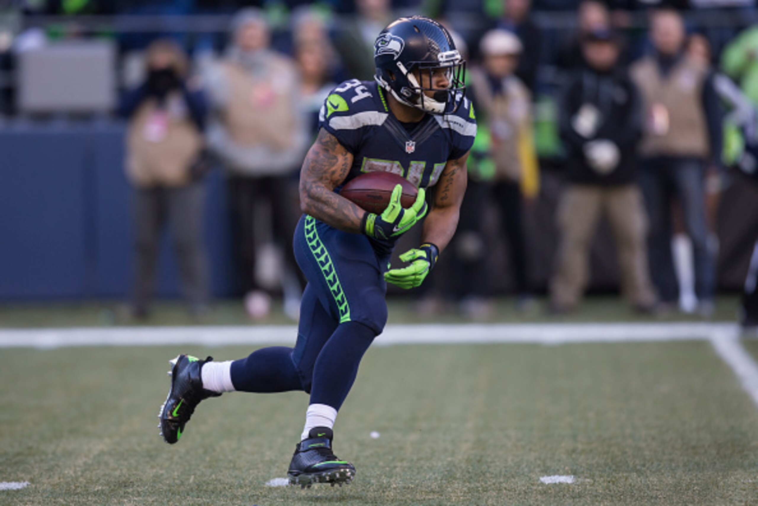 SEATTLE, WA - NOVEMBER 22: Running back Thomas Rawls #34 of the Seattle Seahawks runs with the ball during the football game against the San Francisco 49ers at CenturyLink Field on November 22, 2015 in Seattle, Washington. The Seahawks won the game 29-13.