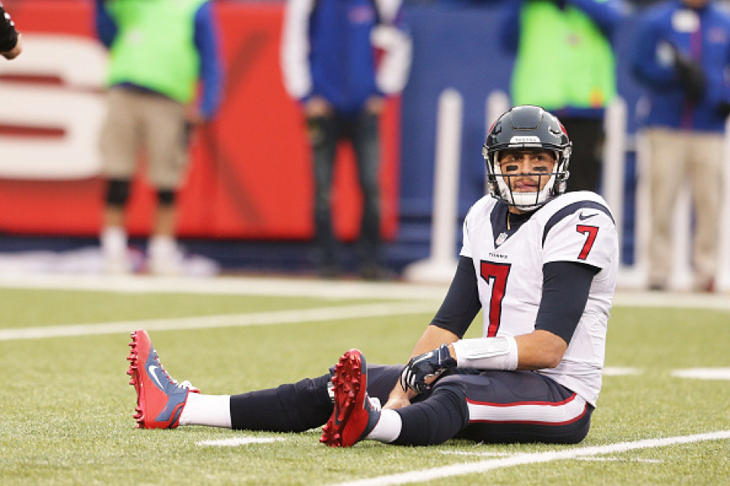 ORCHARD PARK, NY - DECEMBER 06:  Brian Hoyer #7 of the Houston Texans sits on the turf after being hit after a throw during the second half against the Buffalo Bills at Ralph Wilson Stadium on December 6, 2015 in Orchard Park, New York.  (Photo by Brett C