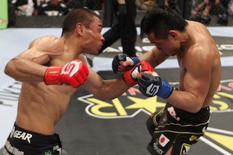 SAN DIEGO, CA - APRIL 09:  (L-R) Robert Peralta punches Hiroyuki Takaya during a featherweight bout at the Strikeforce event at the Valley View Casino Center on April 9, 2011 in San Diego, California.  (Photo by Esther Lin/Zuffa LLC/Zuffa LLC via Getty Im
