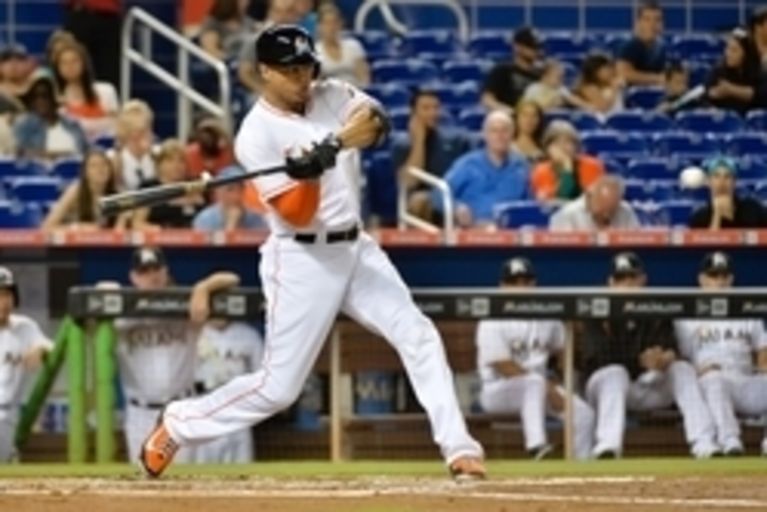 Jun 11, 2015; Miami, FL, USA; Miami Marlins right fielder Giancarlo Stanton (27) connects for a three run homer during the first inning against the Colorado Rockies at Marlins Park. Mandatory Credit: Steve Mitchell-USA TODAY Sports