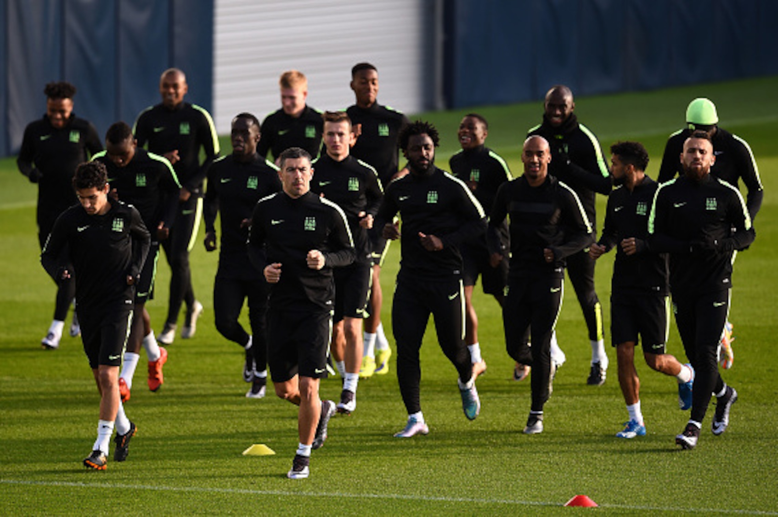 MANCHESTER, ENGLAND - DECEMBER 07:  The Manchester City players warm up during a training session ahead of the UEFA Champions League match against Borussia Moenchengladbach at the City Football Academy on December 7, 2015 in Manchester, England.  (Photo b
